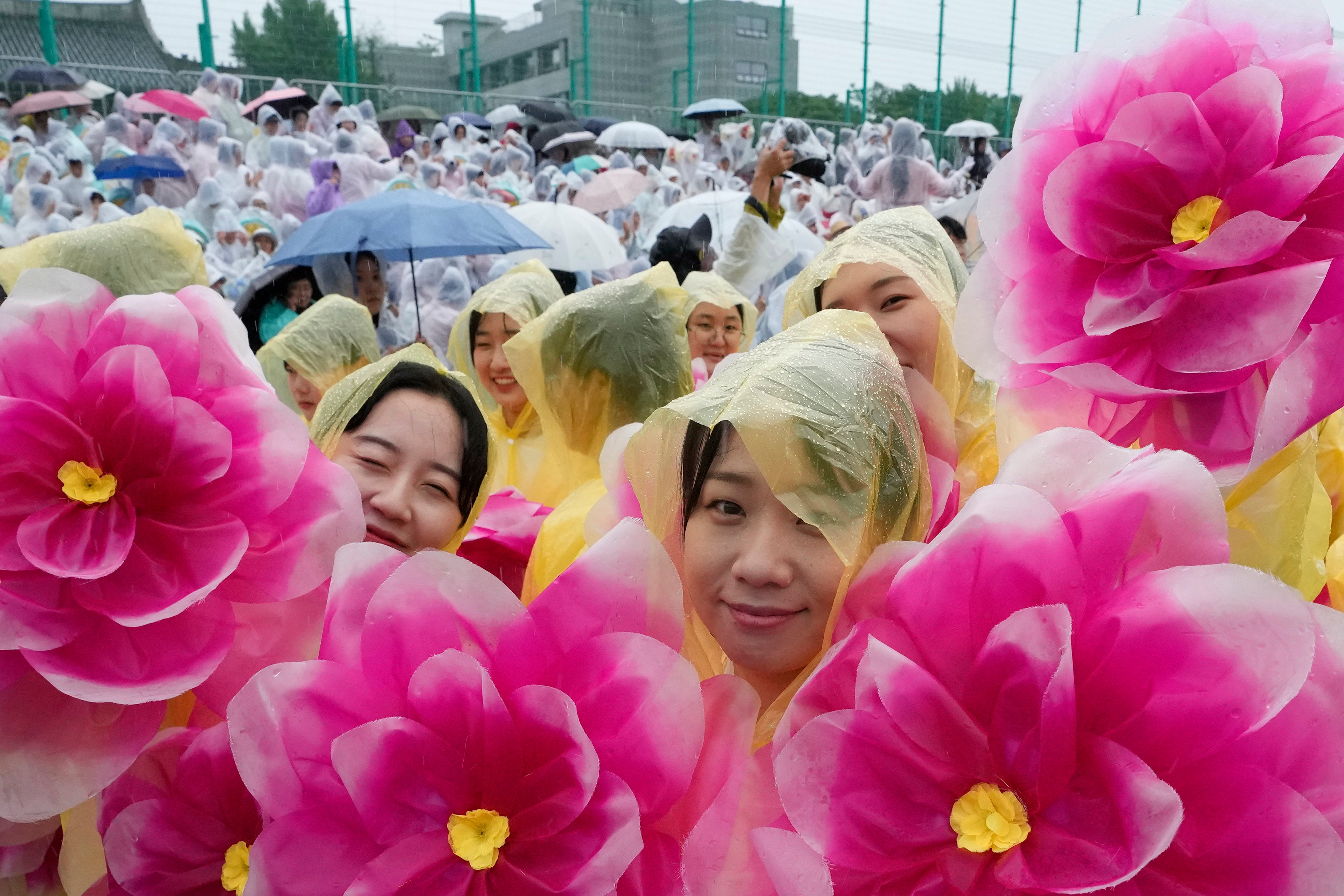 Buddhists wait for a lantern parade as part of festivities celebrating the birthday of Buddha, at Dongguk University