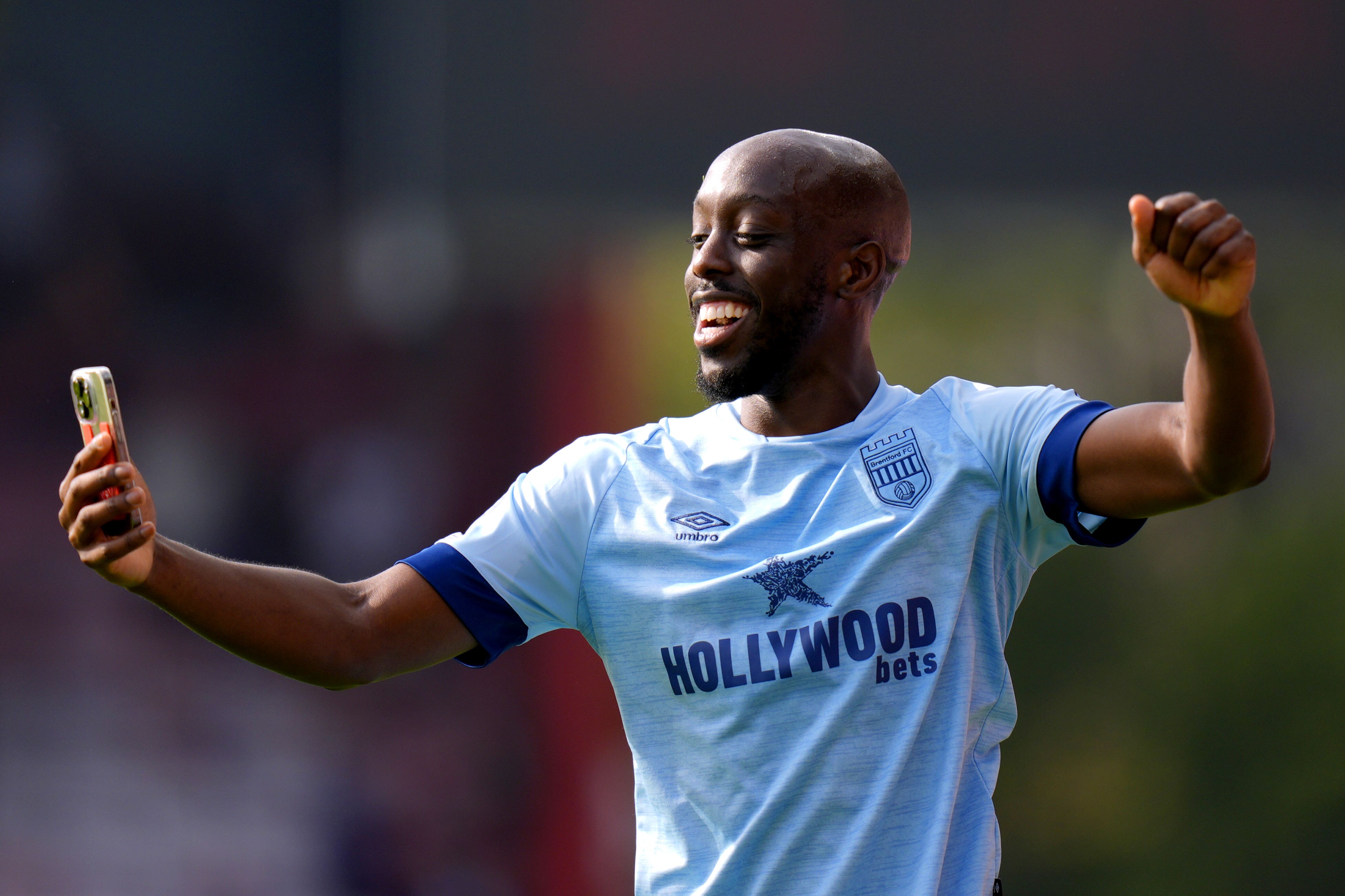 Brentford’s Yoane Wissa films a video on a phone at the end of the game (Andrew Matthews/PA)