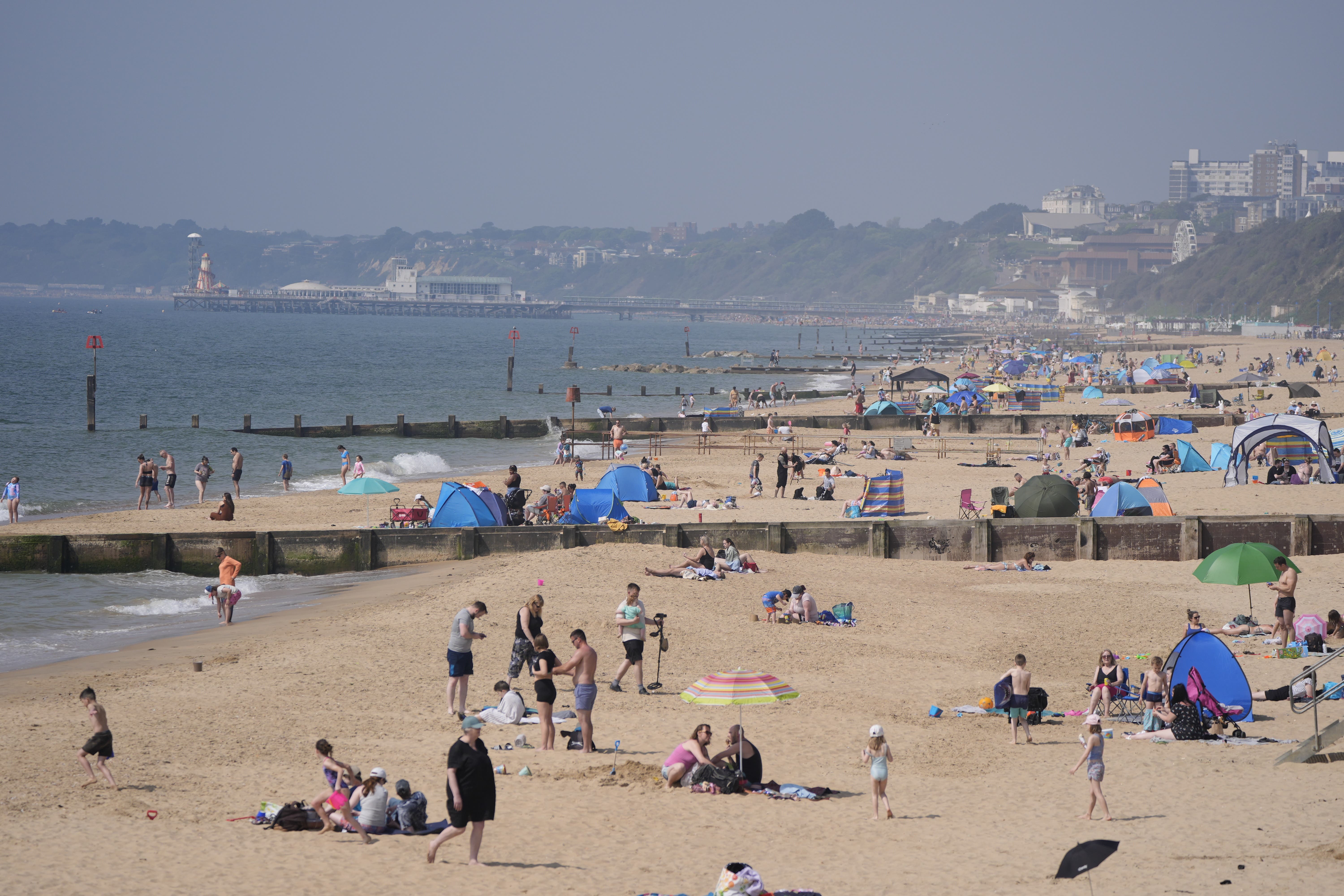 People enjoying the sunny weather on Boscombe Beach in Bournemouth, Dorset (Andrew Matthews/PA)