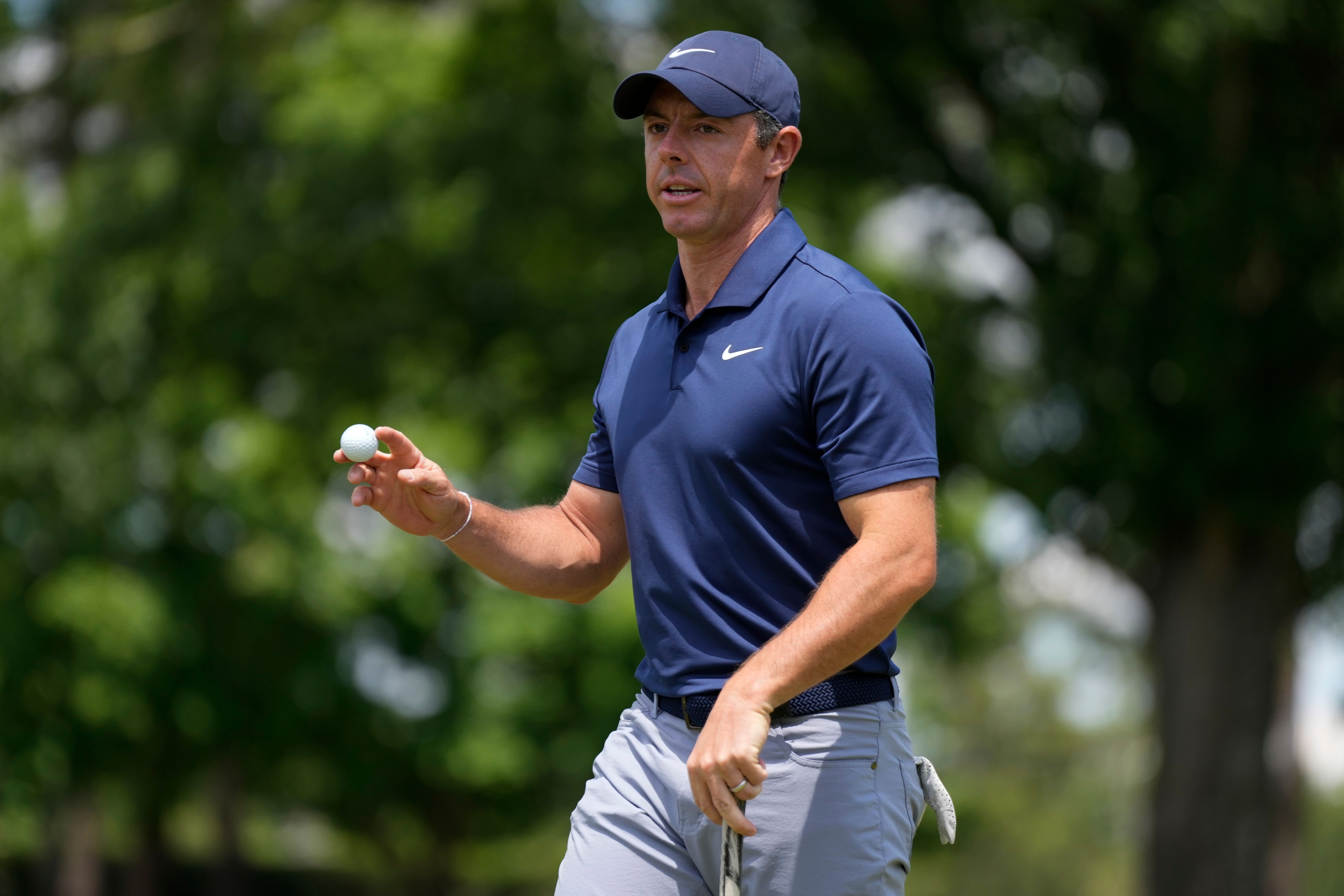 Rory McIlroy waves after making a putt on the fifth hole at Quail Hollow (Chris Carlson/AP)