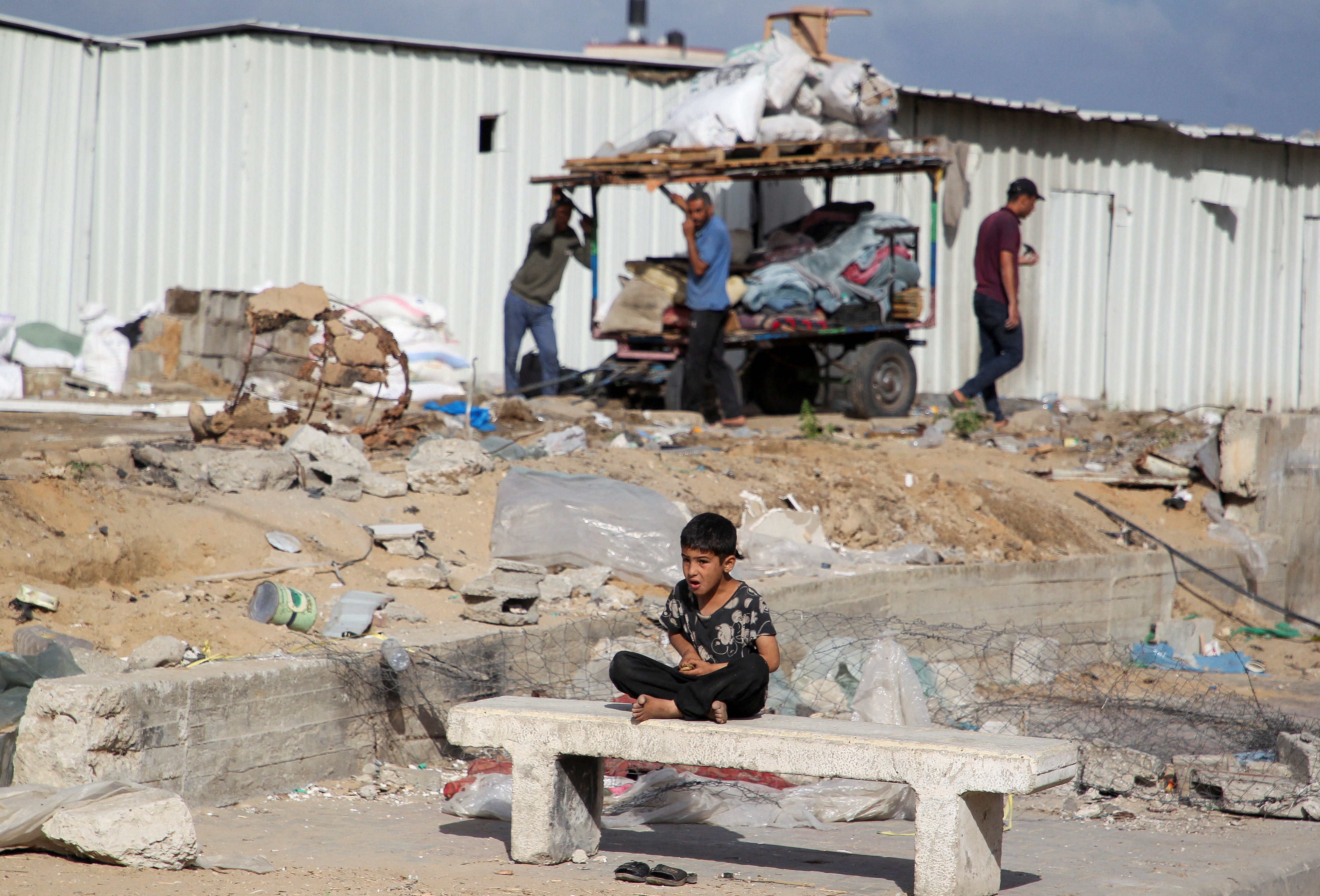 A boy looks on as Palestinians prepare to flee Rafah after Israeli forces launched a ground and air operation in the eastern part of the southern Gaza city on 12 May