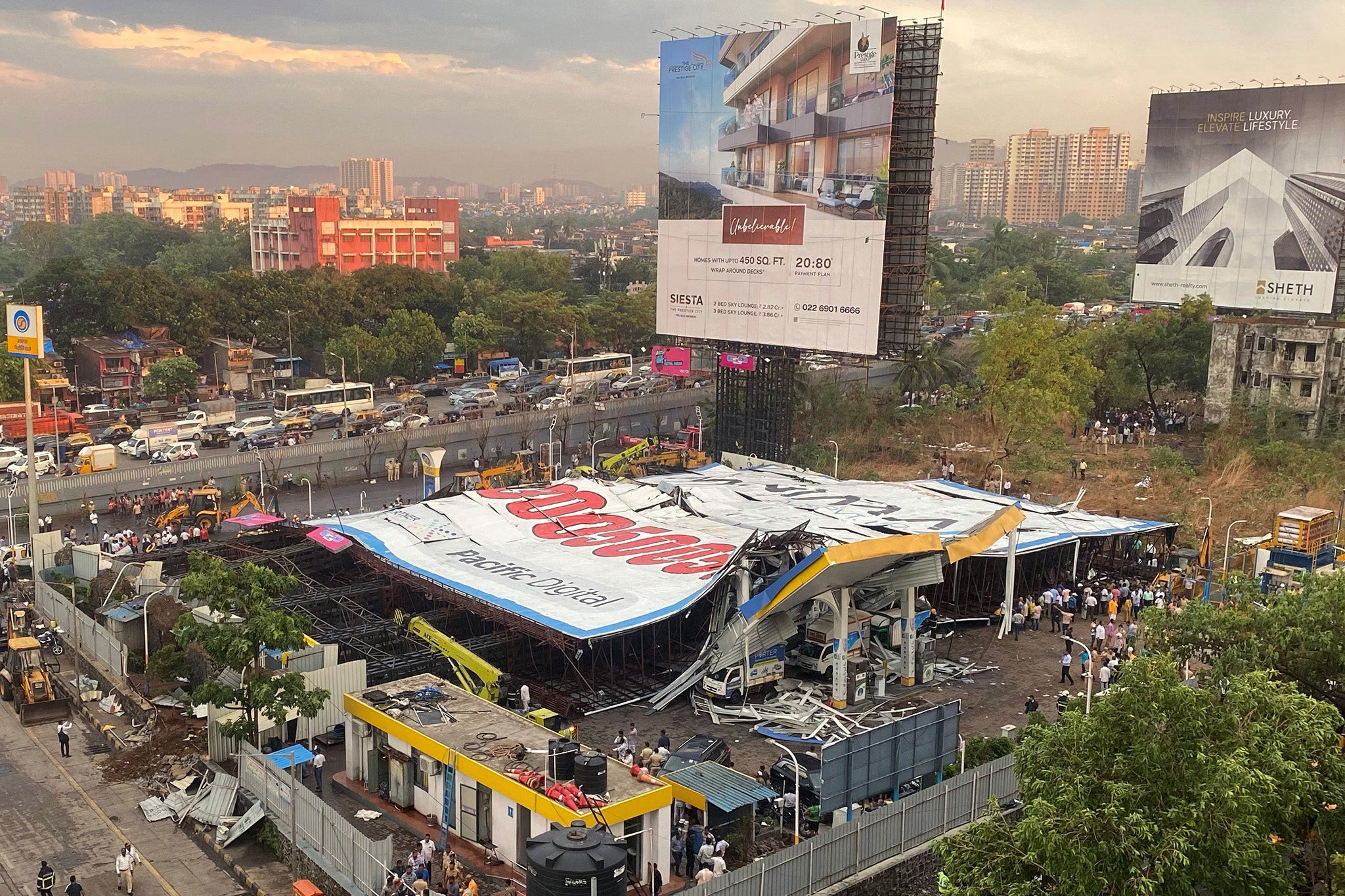 A rescue operation for the people remaining trapped under the billboard is ongoing