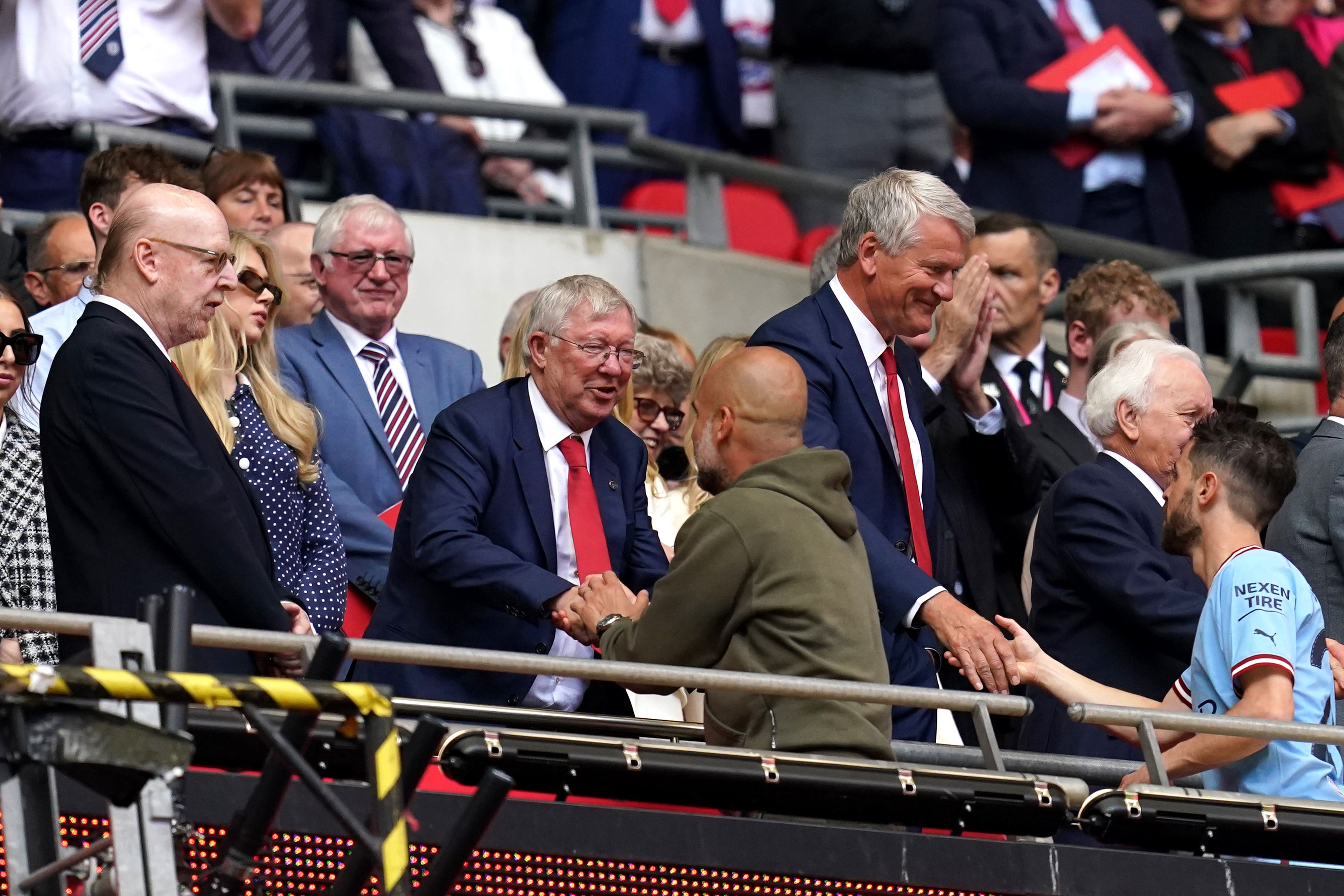 Sir Alex Ferguson greets Manchester City manager Pep Guardiola (Nick Potts/PA)