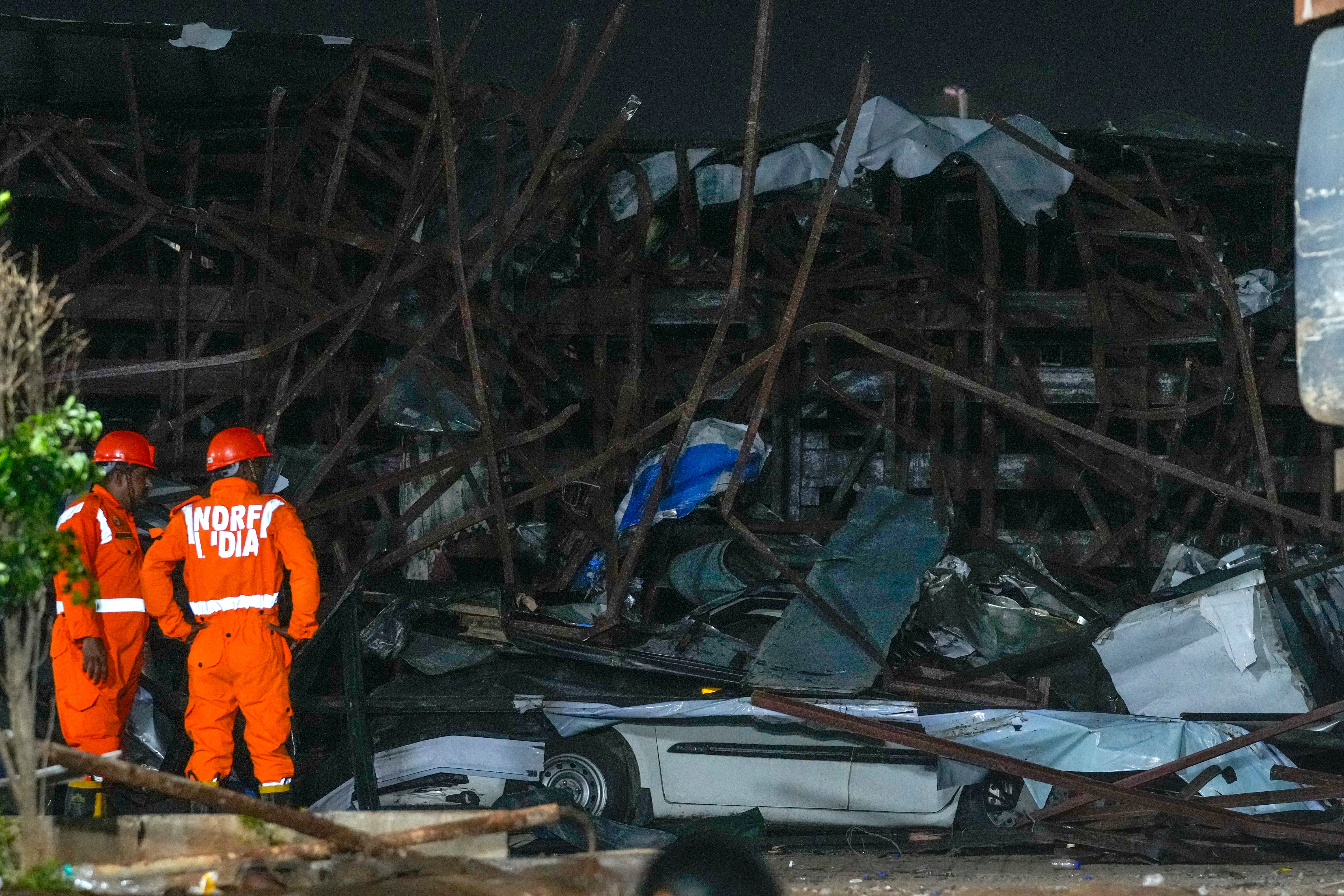 File. Indian rescue workers at the scene of an accident