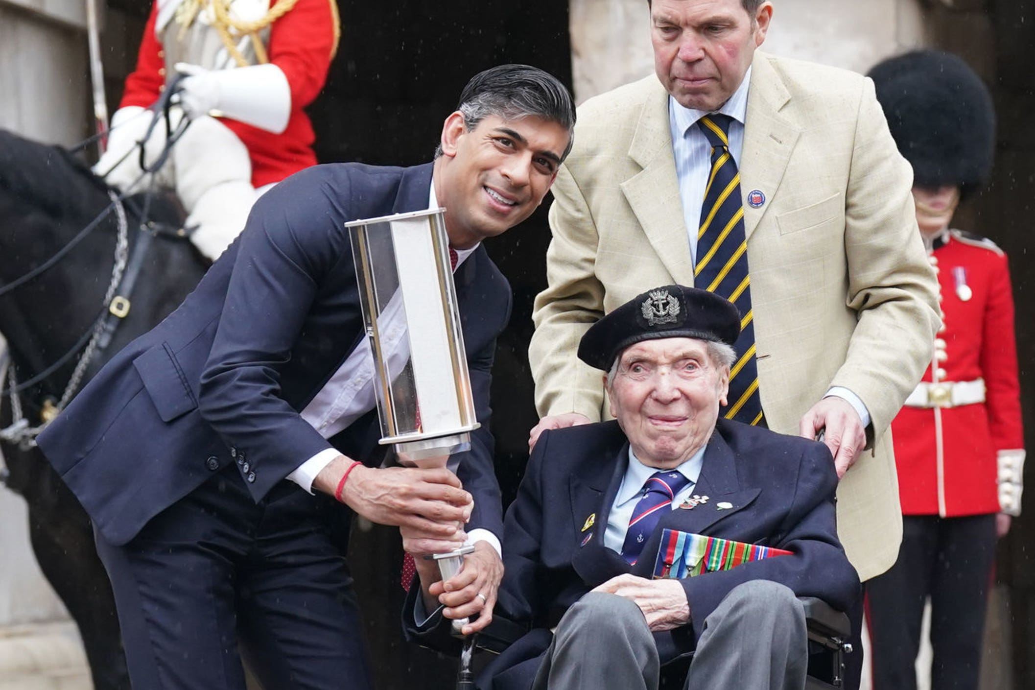 Prime Minister Rishi Sunak with navy seaman D-Day veteran Peter Kent, 99 (Stefan Rousseau/PA)