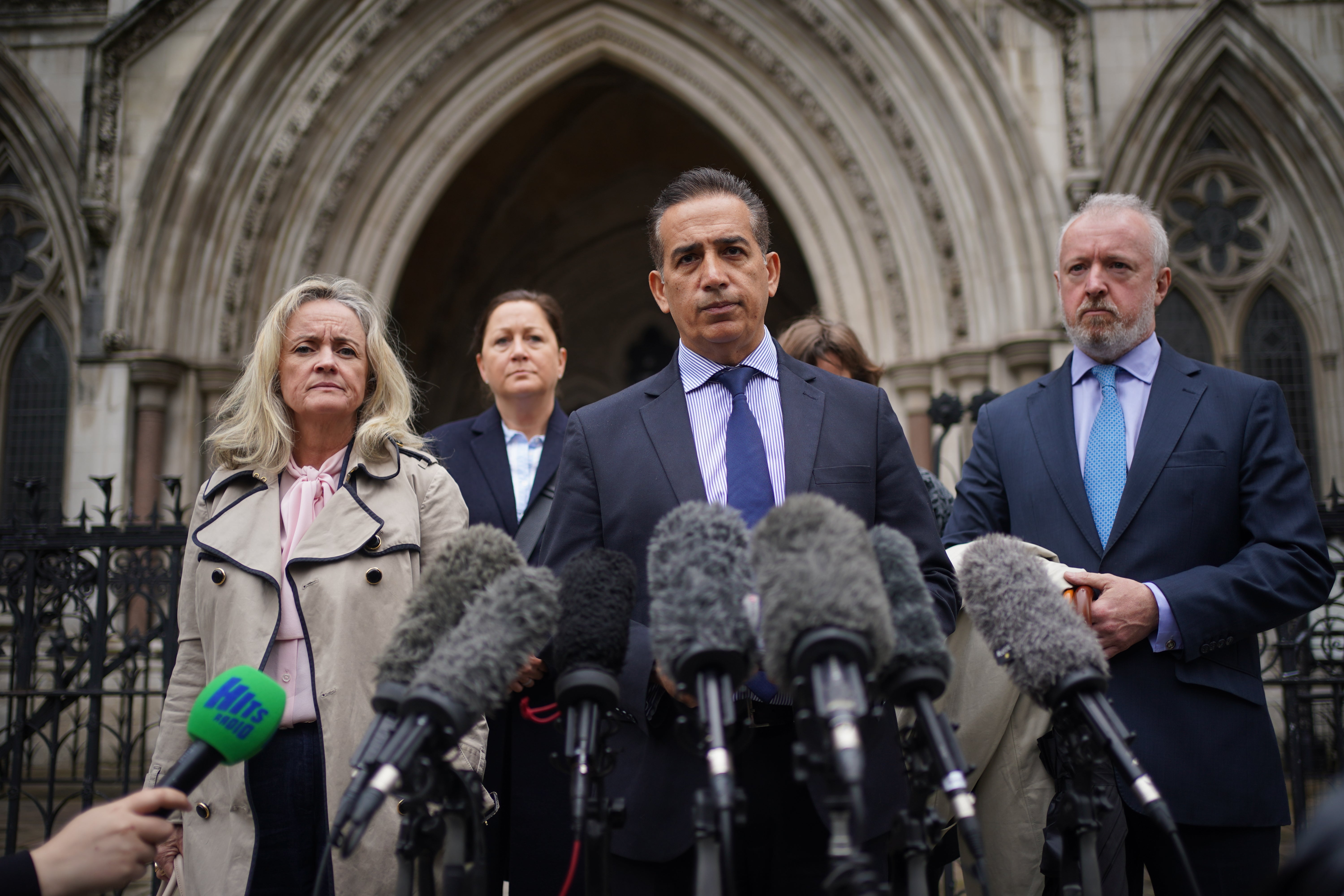 Parents of Grace O’Malley-Kumar, Dr Sanjoy Kumar (centre) and Dr Sinead O’Malley (left) outside the Royal Courts of Justice