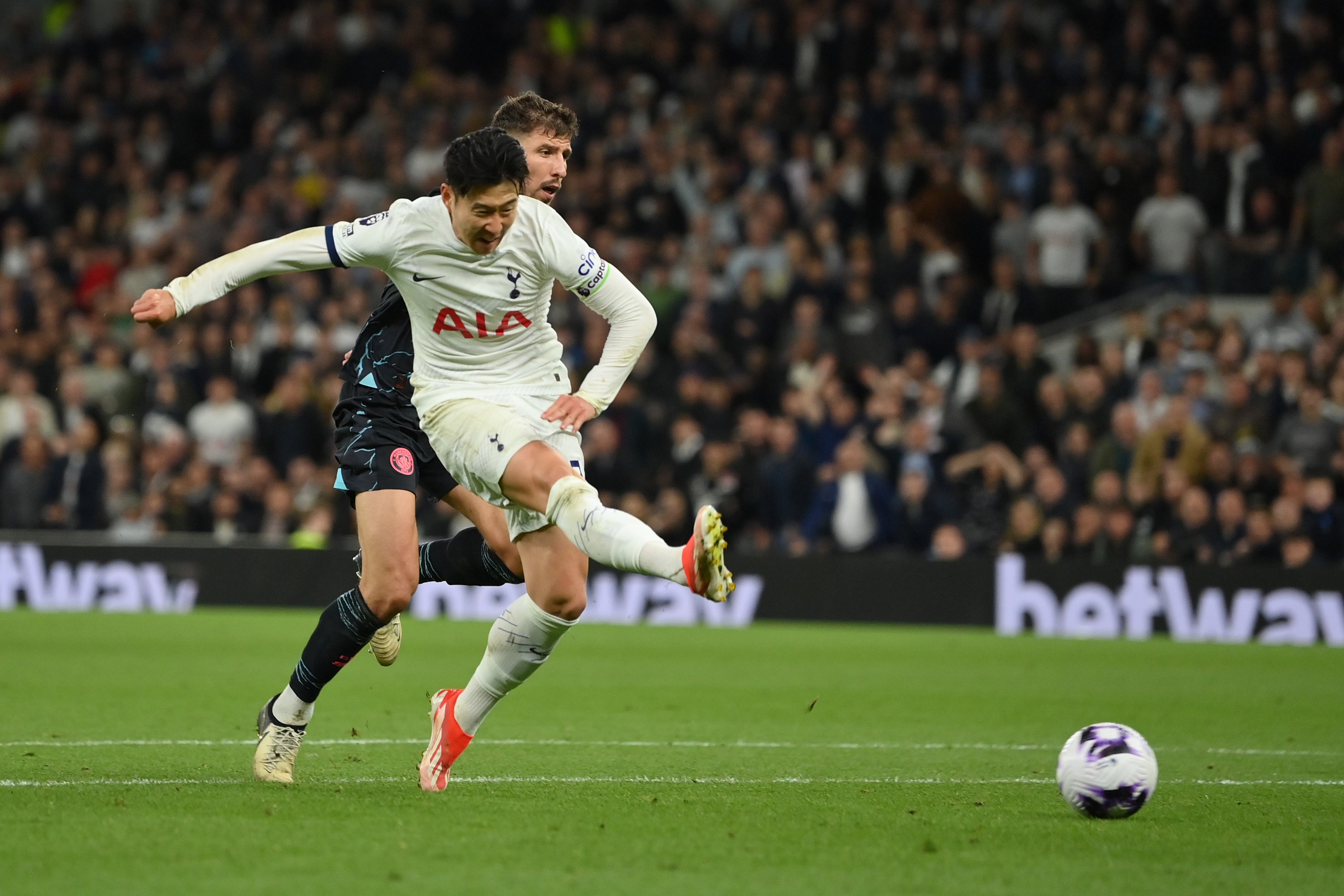 Tottenham captain Son Heung-min shoots at goal after racing through