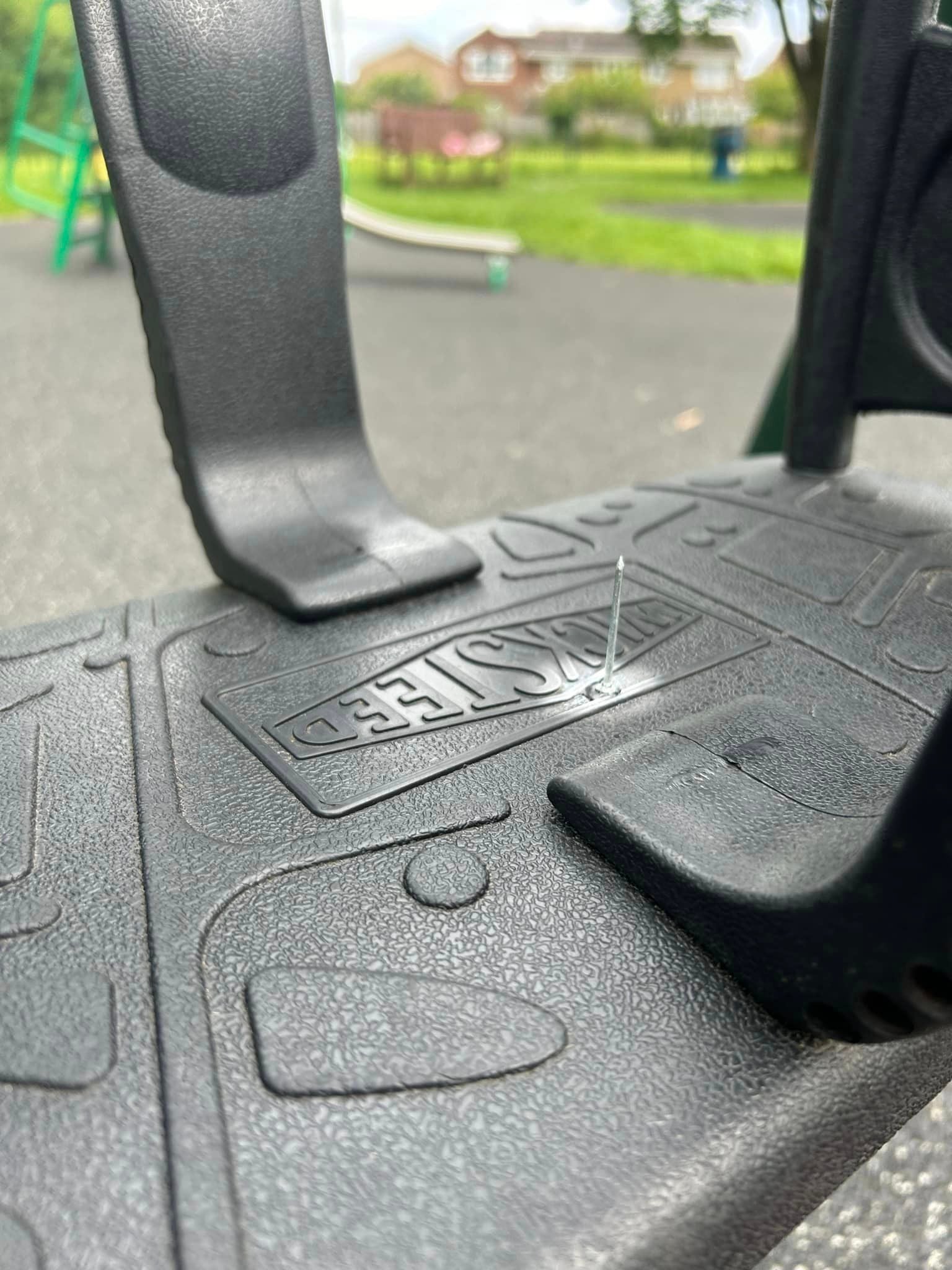 A nail was glued to the swing of the playground