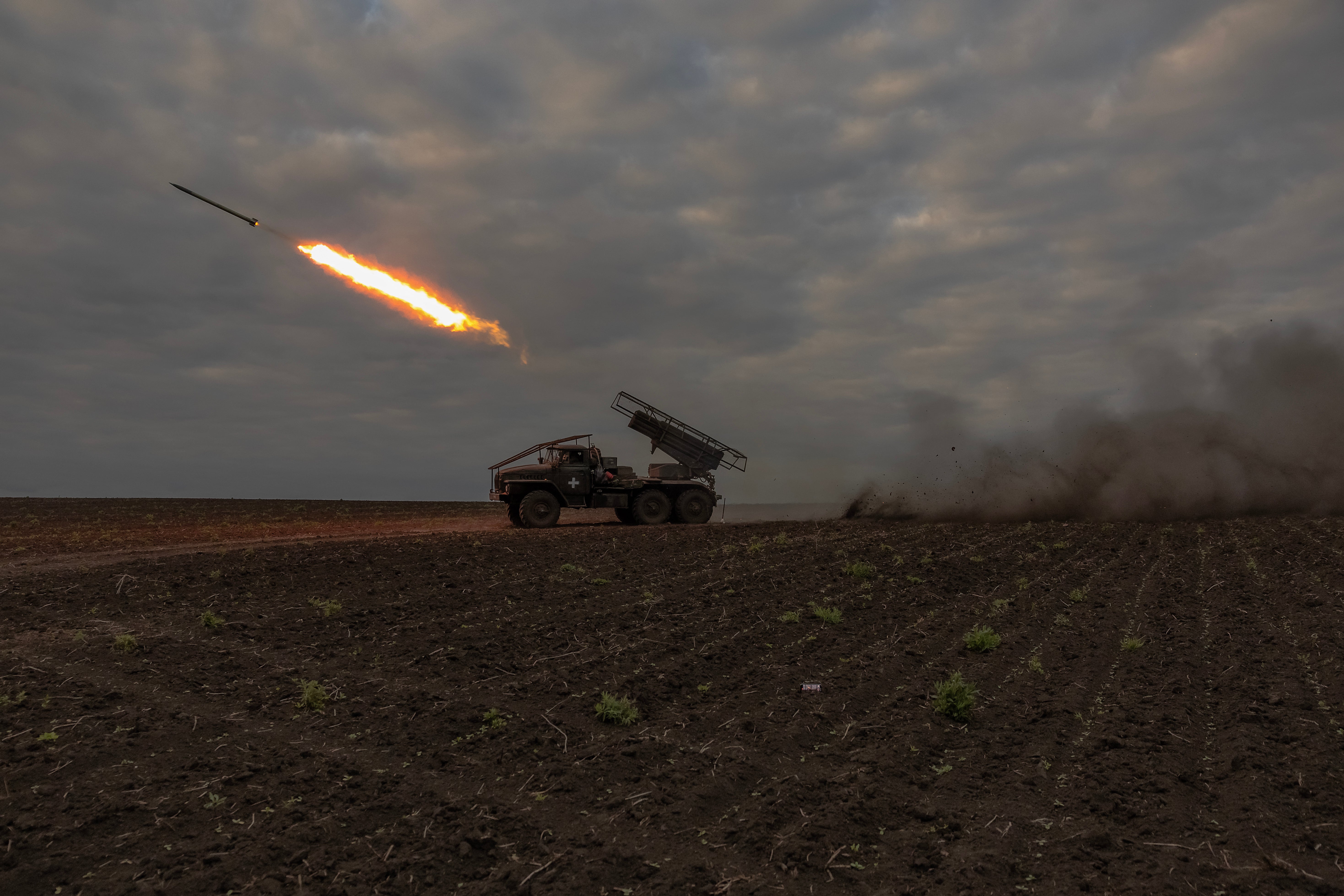 Ukrainian servicemen of the 92nd Assault Brigade fire BM-21 'Grad' multiple rocket launcher toward Russian positions, in the Kharkiv region