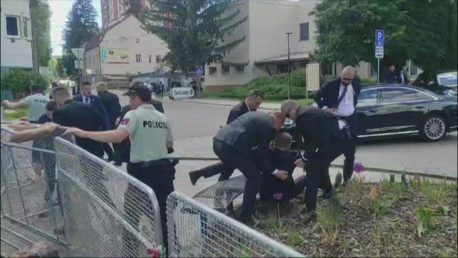 Video footage obtained by AFPTV shows security personnel carrying Slovakia's Prime Minister Robert Fico (C) towards a vehicle