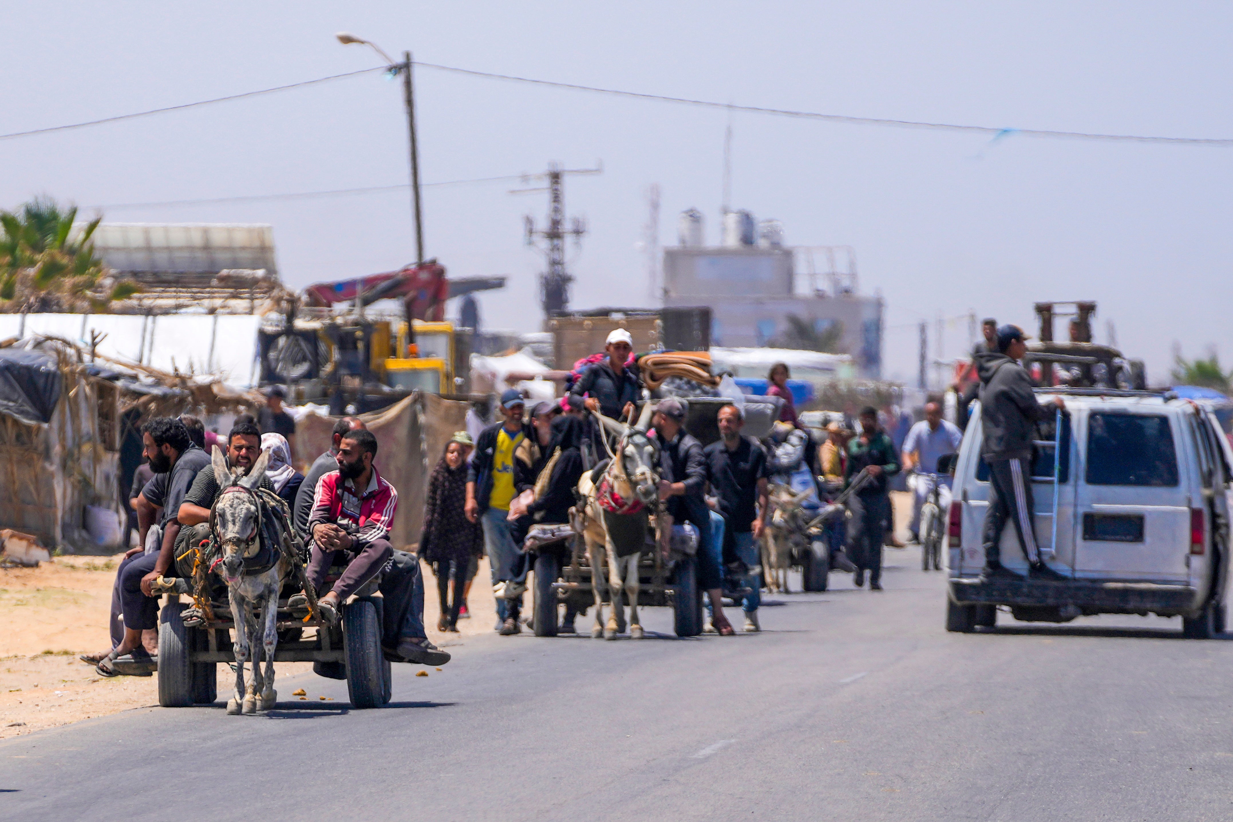 Displaced Palestinians arrive in central Gaza after fleeing from the southern Gaza city of Rafah in Deir al Balah, on May 9, 2024.