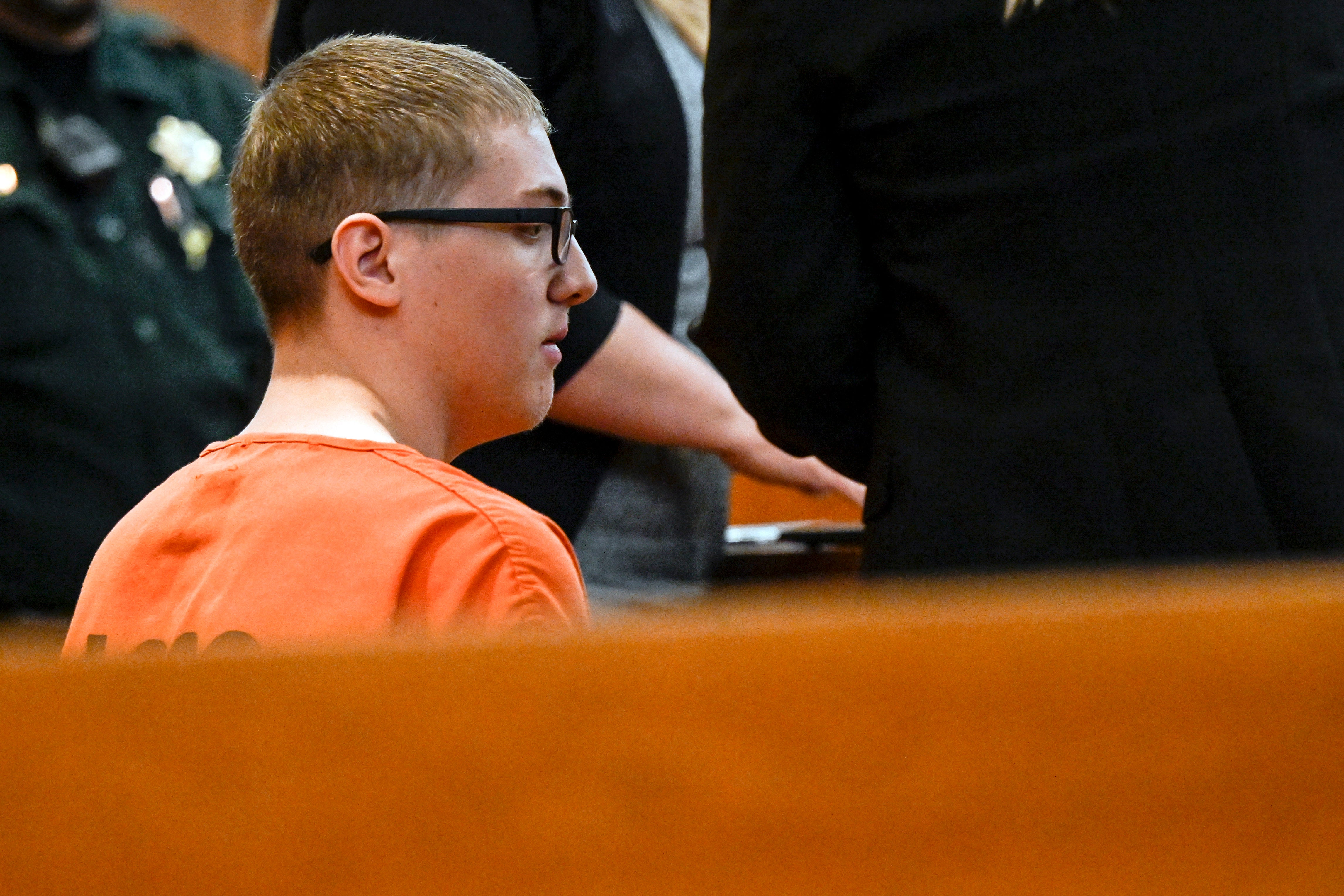 Defendant Nicholas Karol-Chik listens to District Court Judge Christopher C. Zenisek during an arraignment in Jefferson County District Court, 3 May 2023