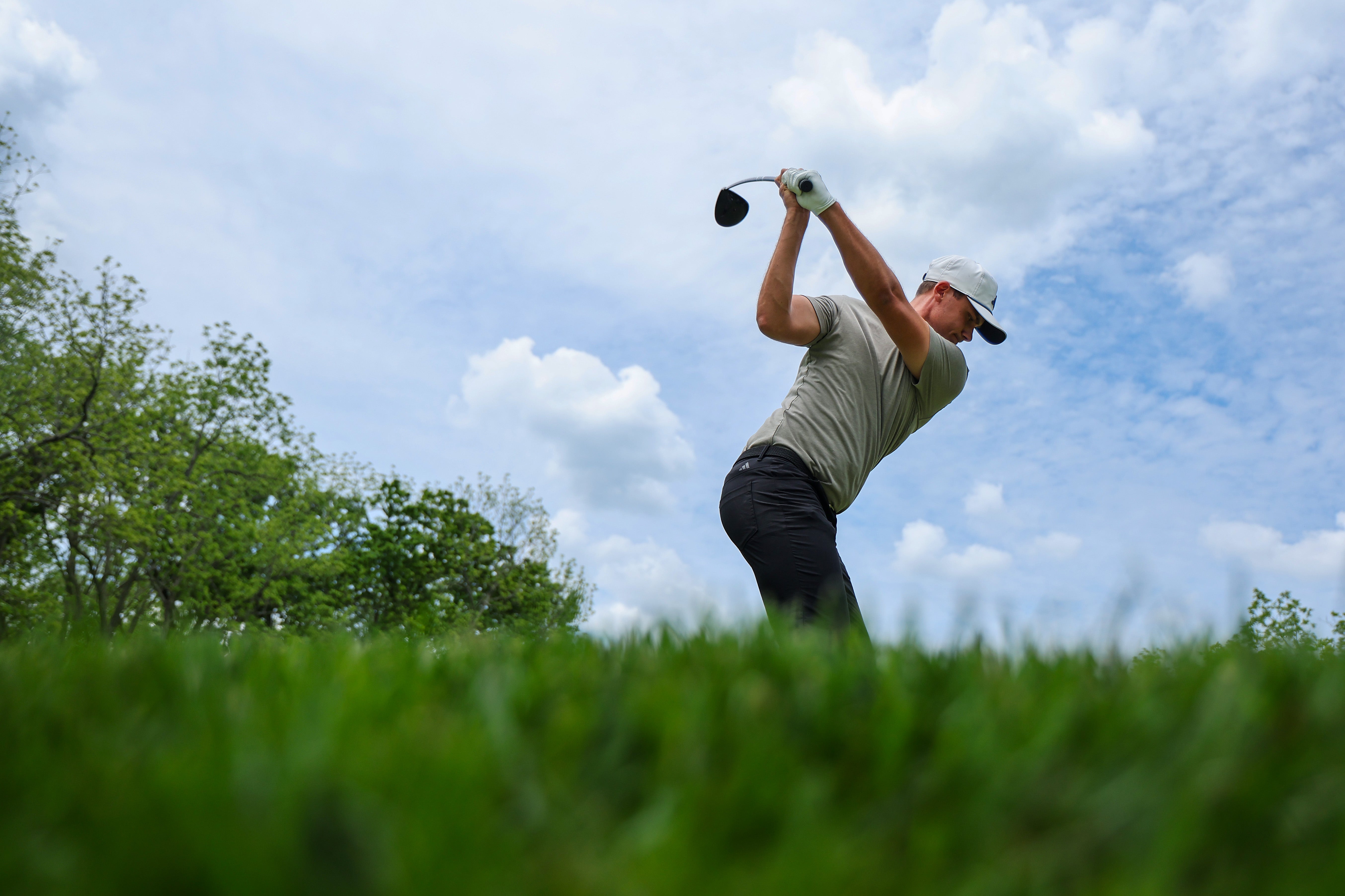 Aberg plays a tee shot during a practice round before the PGA Championship