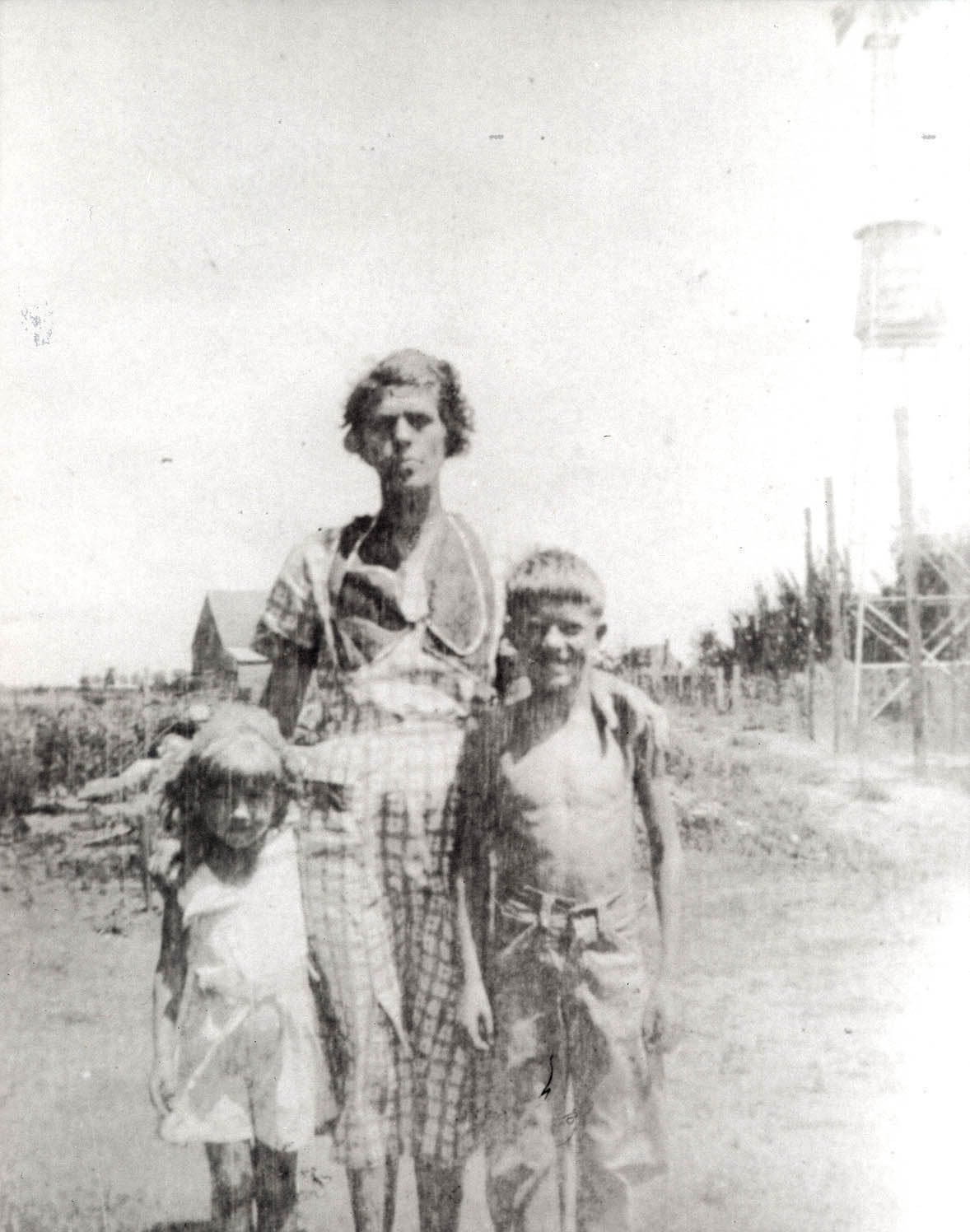 Ruth, Lillian, and Jimmy Carter standing in the foreground