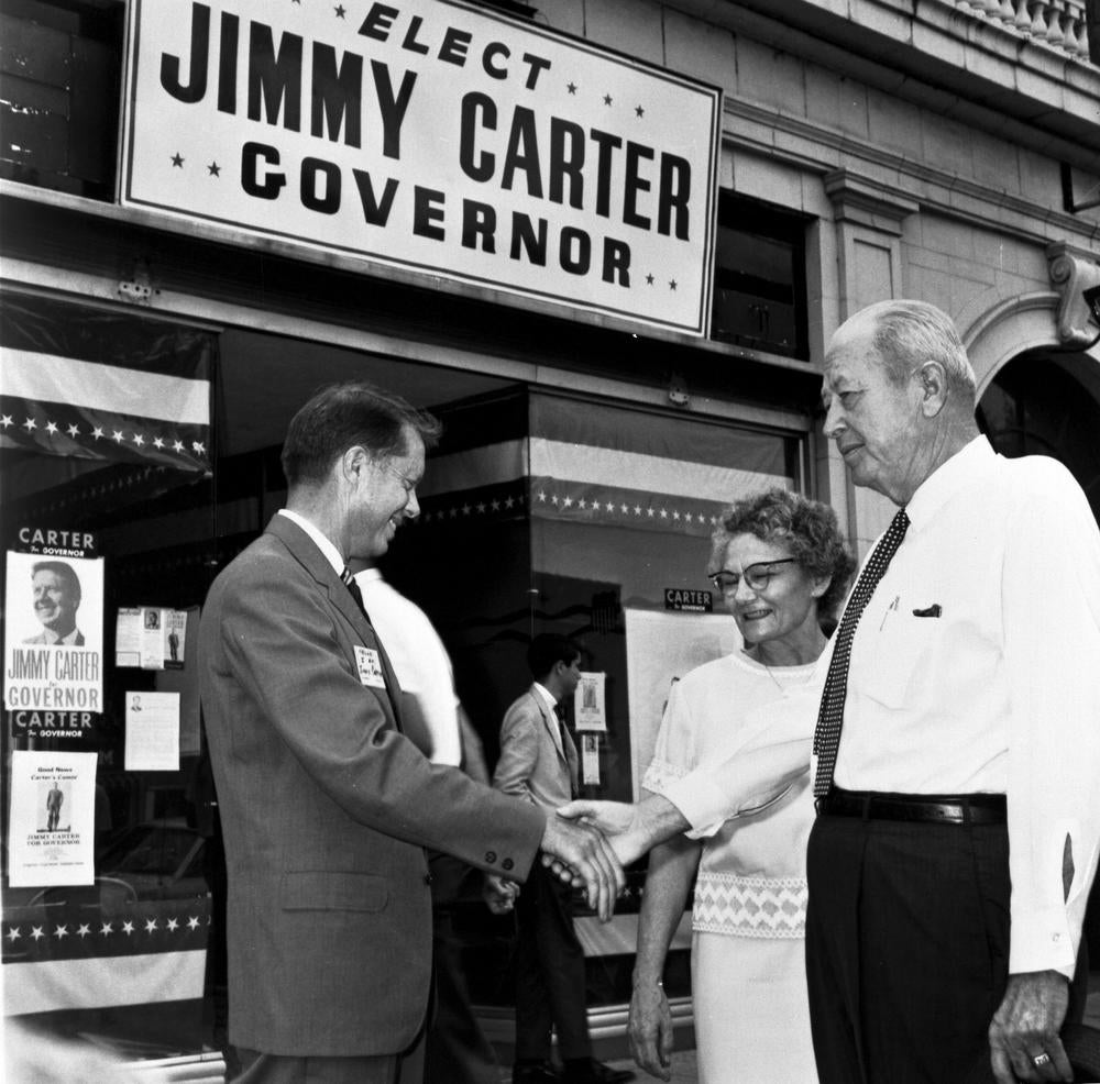 Jimmy Carter shakes hands with voters as he runs for Governor. Before the end of his first term, he announced his run for president