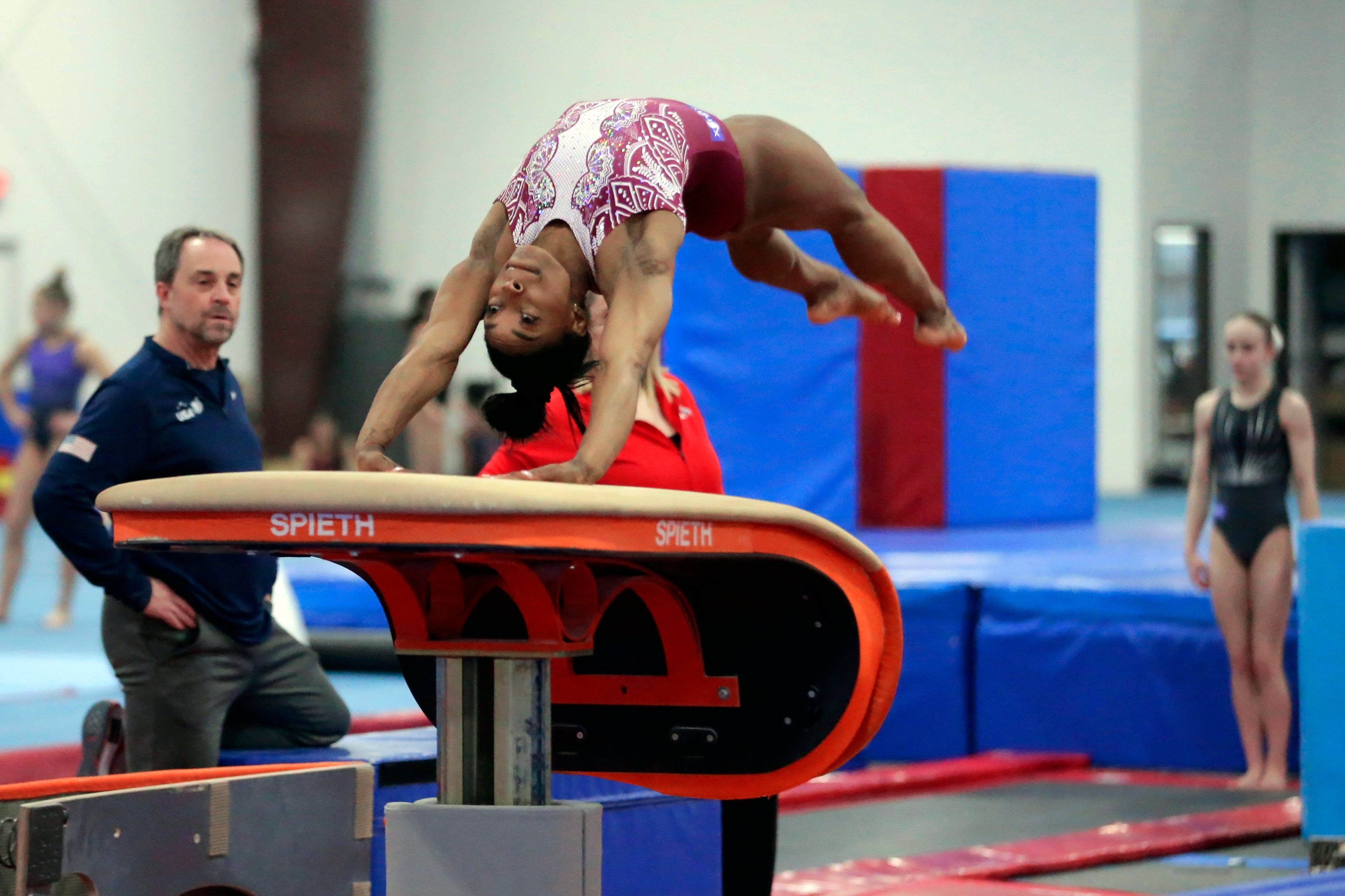 Simone Biles launches off a vault during training at the Stars Gymnastics Sports Center in Katy, Texas, Monday, Feb. 5, 2024