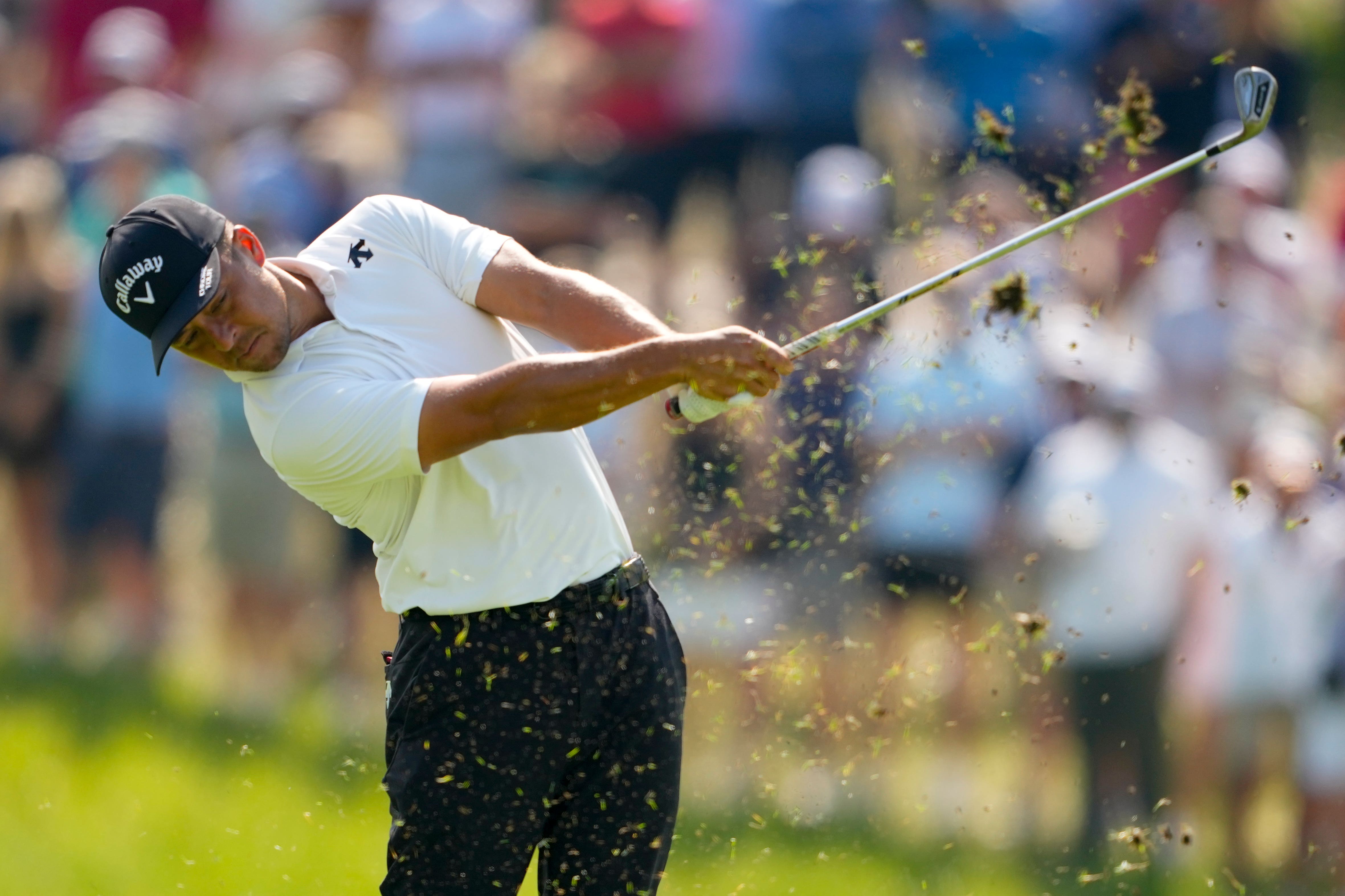 Xander Schauffele hits from the fairway on the 17th hole during the first round of the US PGA Championship (Matt York/AP)