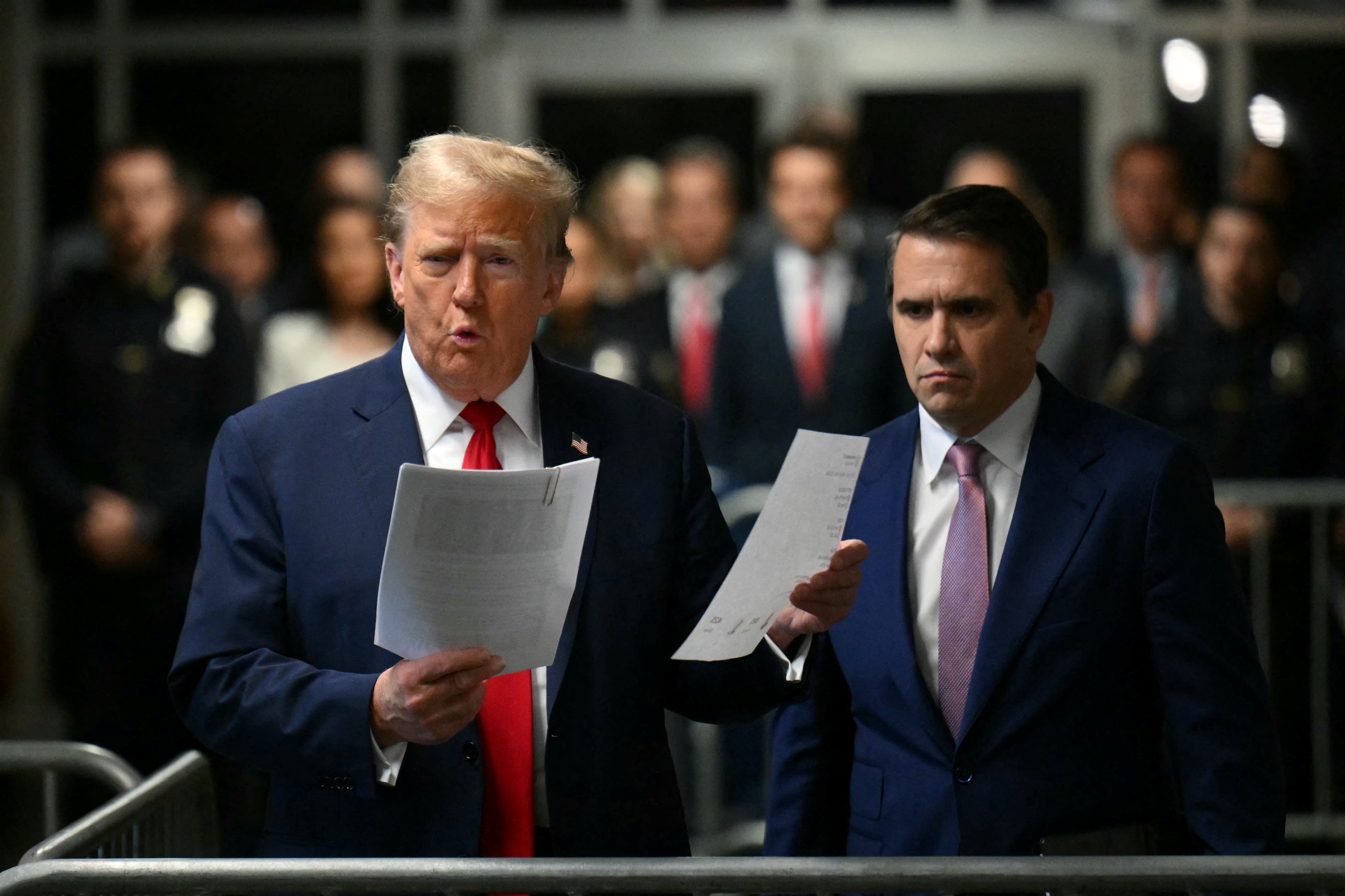 Donald Trump, with lawyer Todd Blanche, speaks to the press on arrival at his trial for allegedly covering up hush money payments linked to extramarital affairs, at Manhattan Criminal Court in New York City, on May 16, 2024