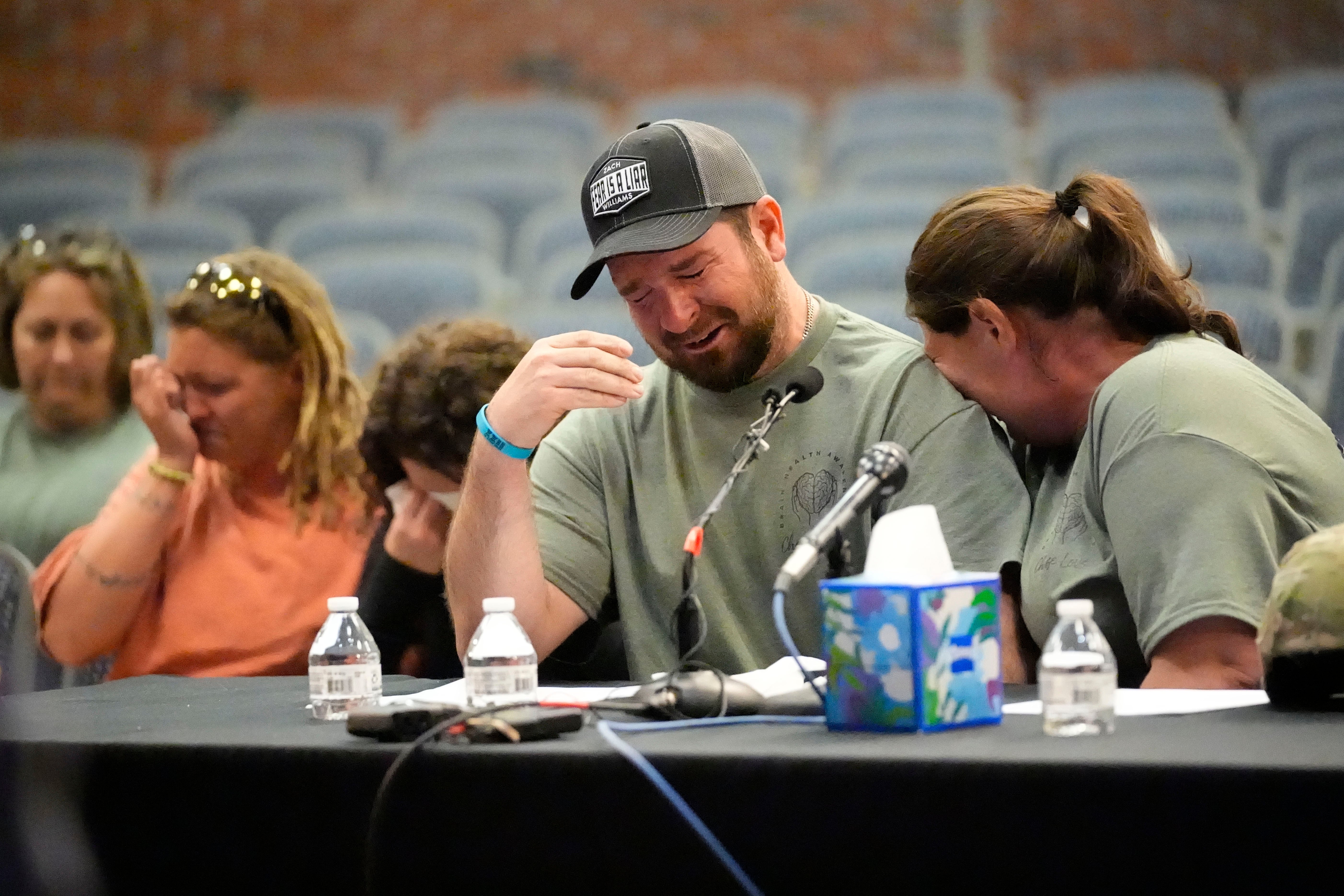 James Herling, seated next to his wife Nicole Herling, pauses his testimony while recalling the moment he realized the shooter was his brother-in-law, Robert Card, while testifying in Thursday