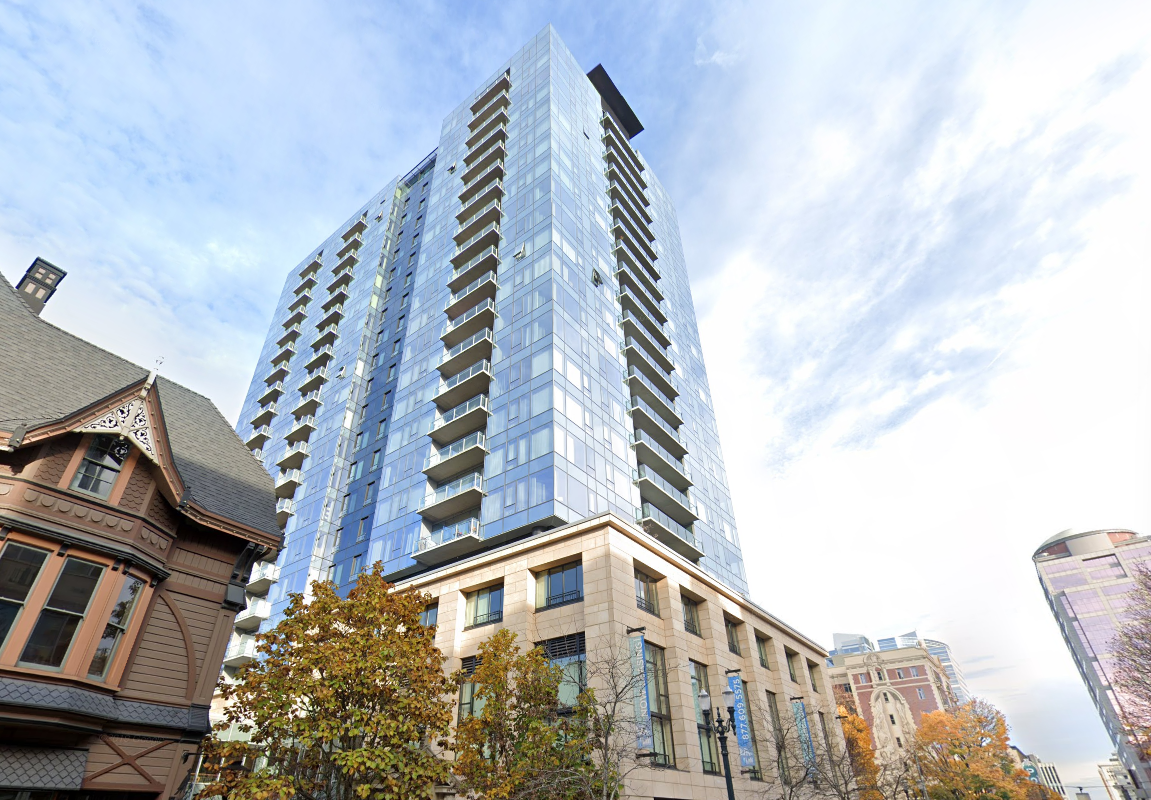 The cans are allegeldy being thrown from an upper-floor unit of Ladd Tower, Portland