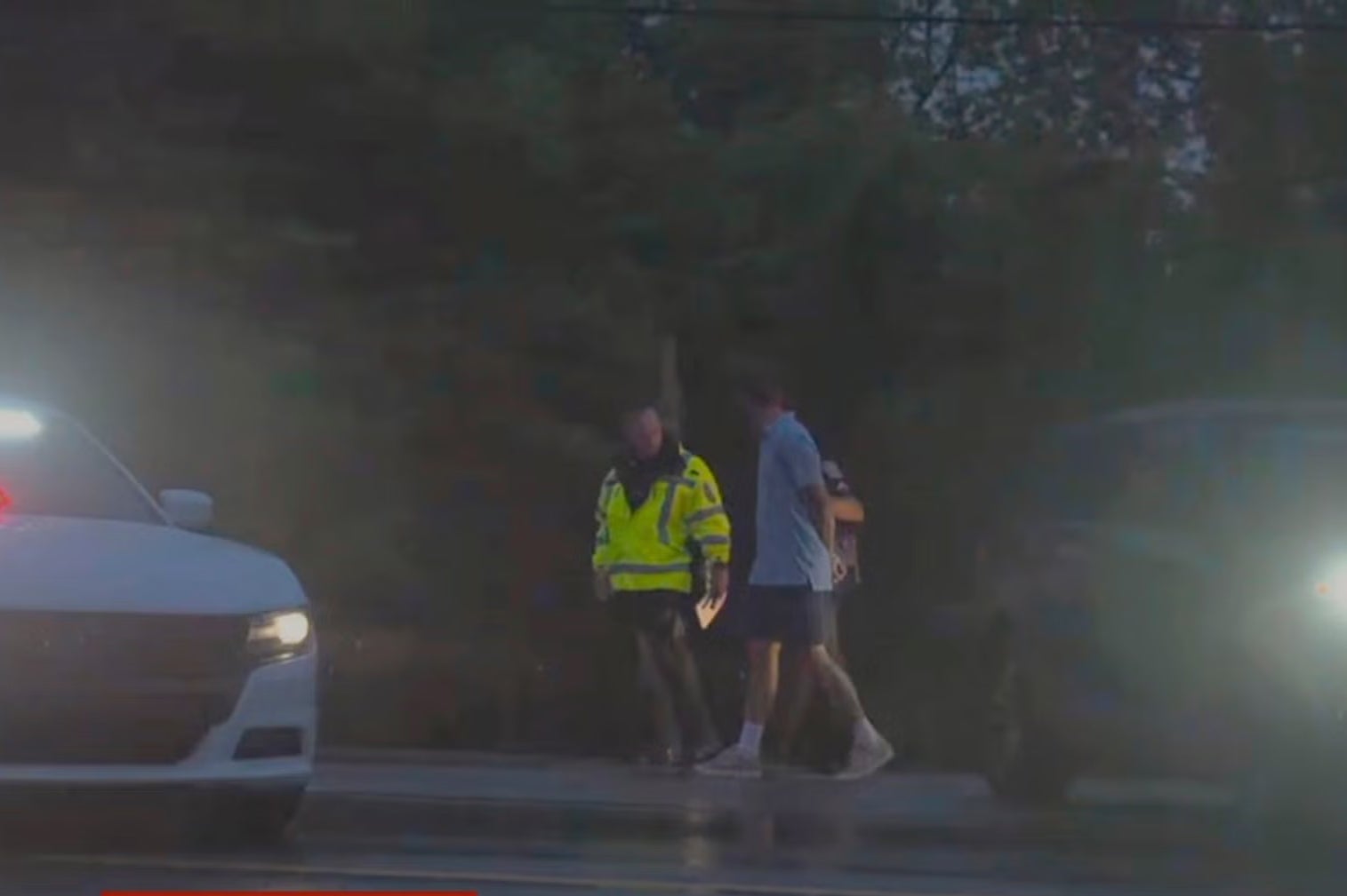 Masters champion Scottie Scheffler is escorted by police after being handcuffed near Valhalla Golf Club, site of the PGA Championship golf tournament, early Friday, May 17, 2024