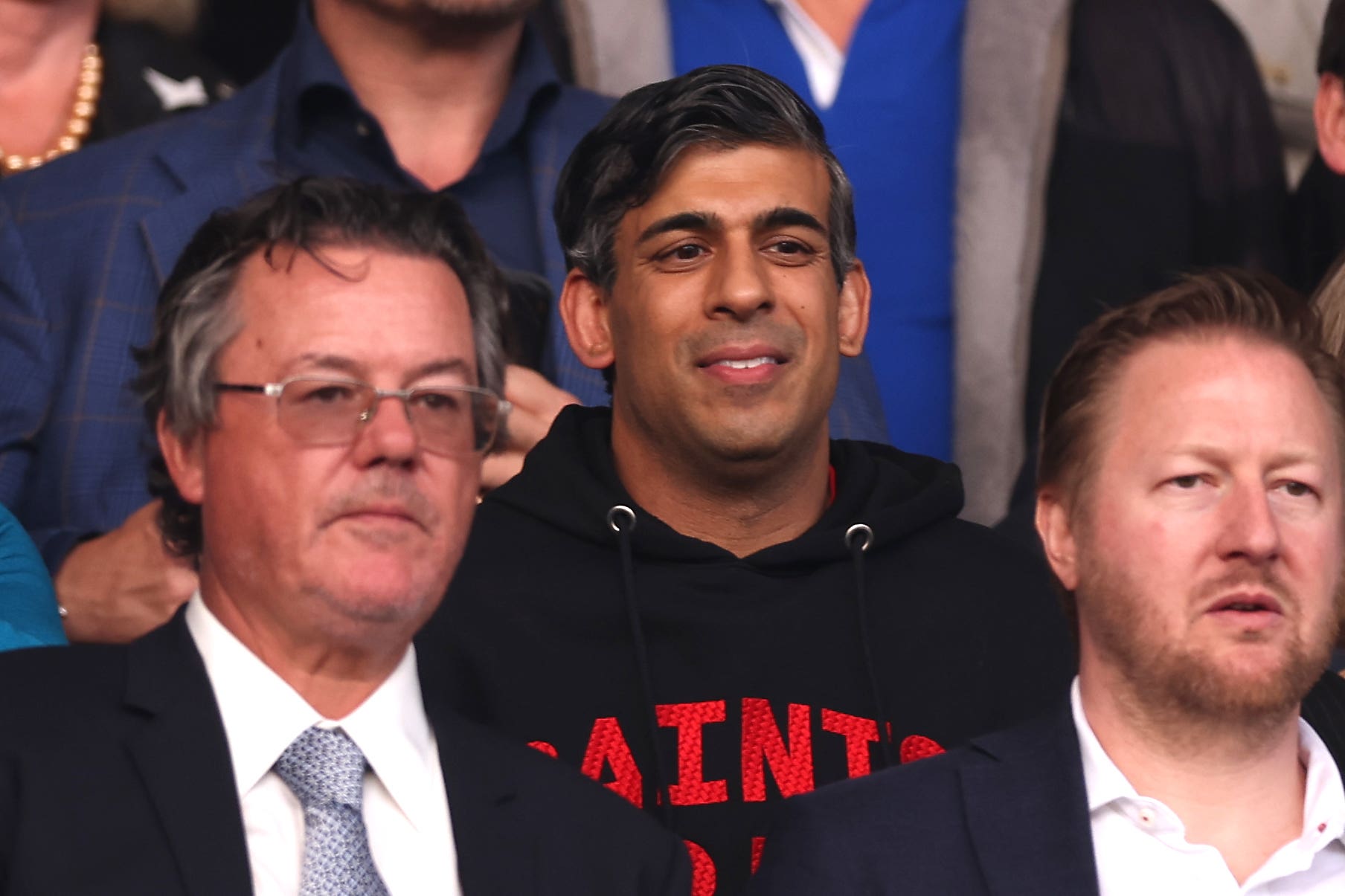 Prime Minister of the United Kingdom Rishi Sunak (centre) during the Sky Bet Championship play-off, semi-final, second leg match at St Mary’s Stadium, Southampton (Steven Paston/AP)