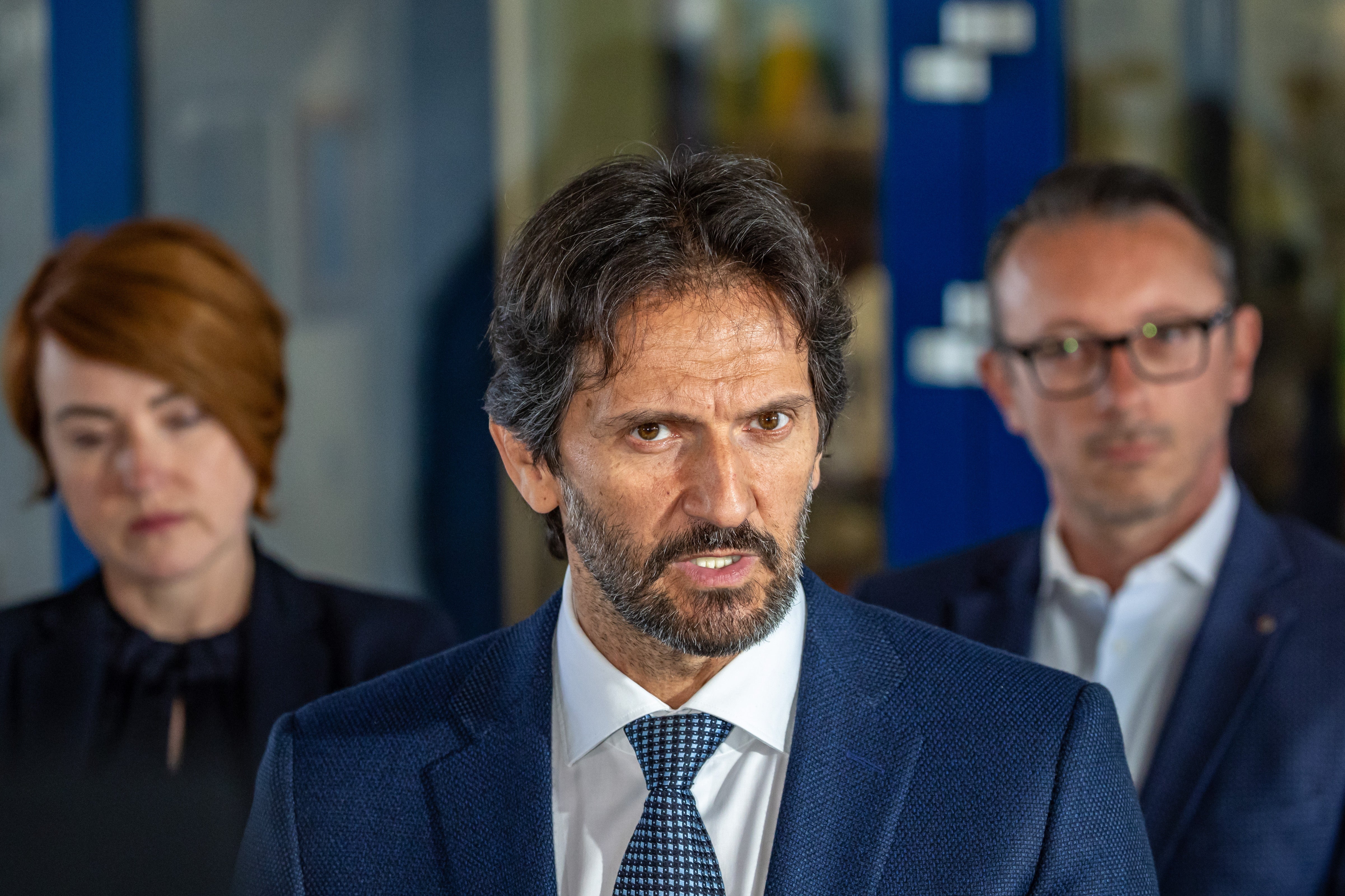 Slovak defence minister and deputy prime minister Robert Kalinak (C), flanked by director of the FD Roosevelt University Hospital Miriam Lapunikova (L), addresses the media outside the hospital