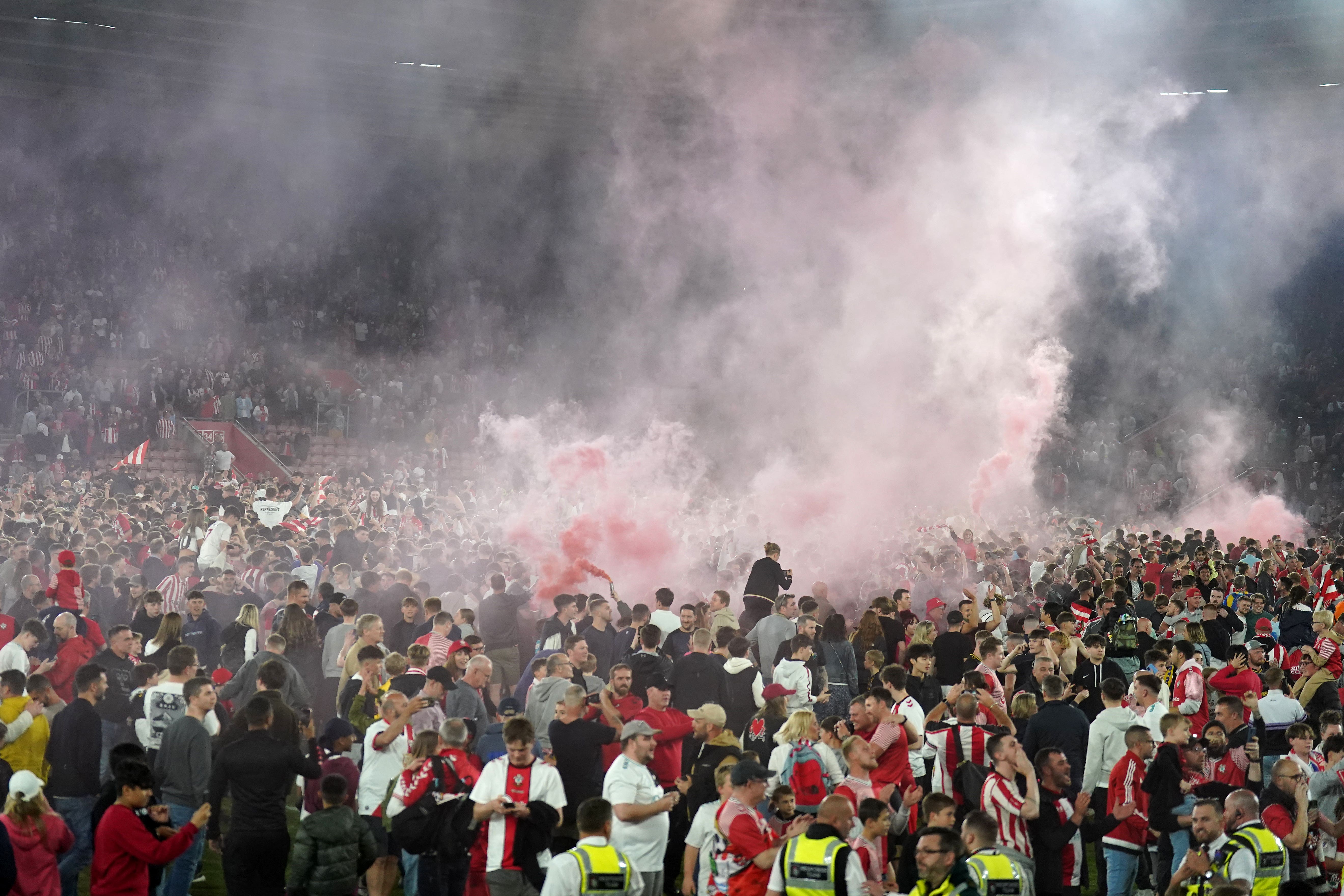 Southampton fans run onto the pitch after victory in the Sky Bet Championship play-off, semi-final, second leg match at St Mary’s Stadium (PA)