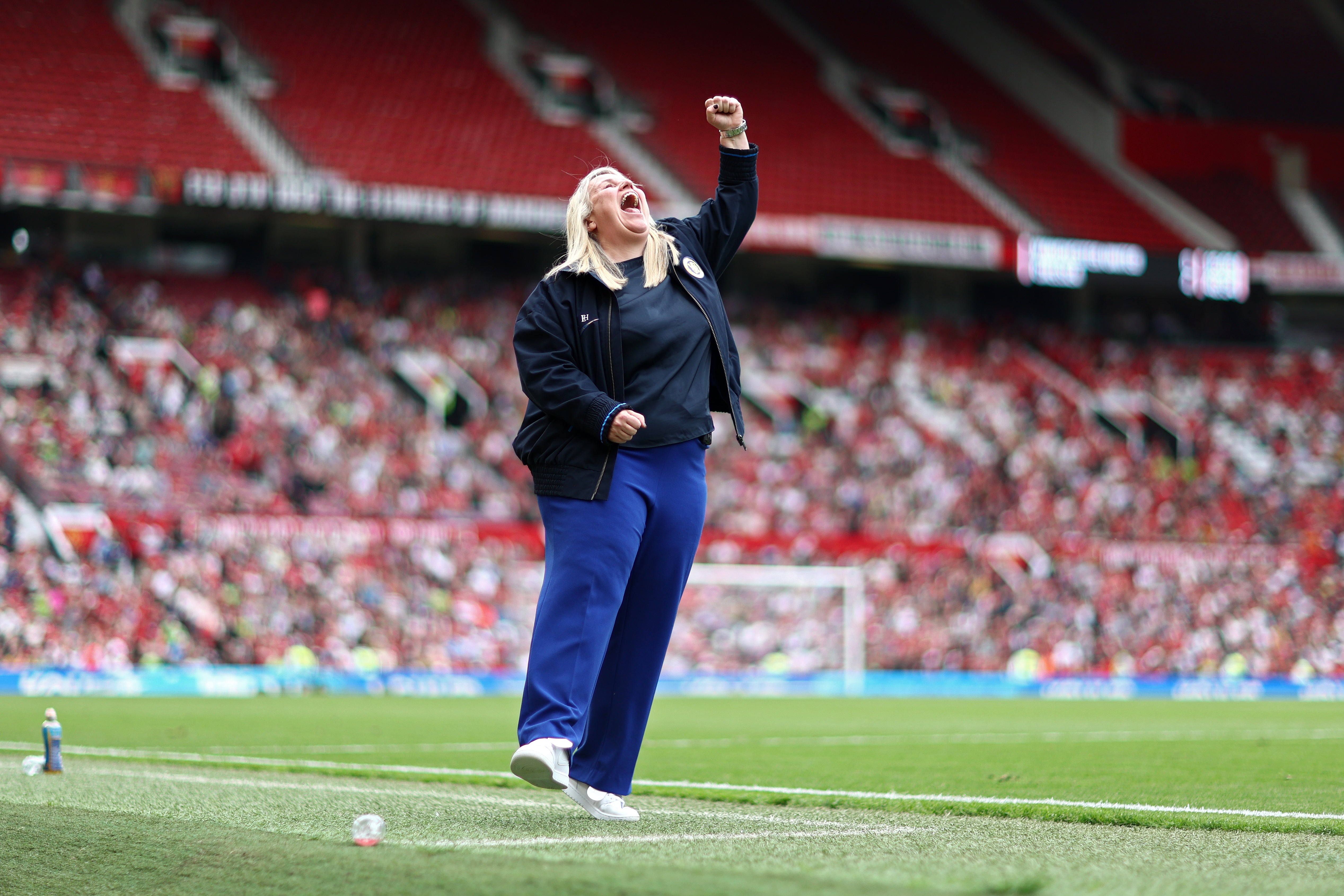 Emma Hayes punches the air as Chelsea thrashed Manchester United to win the WSL