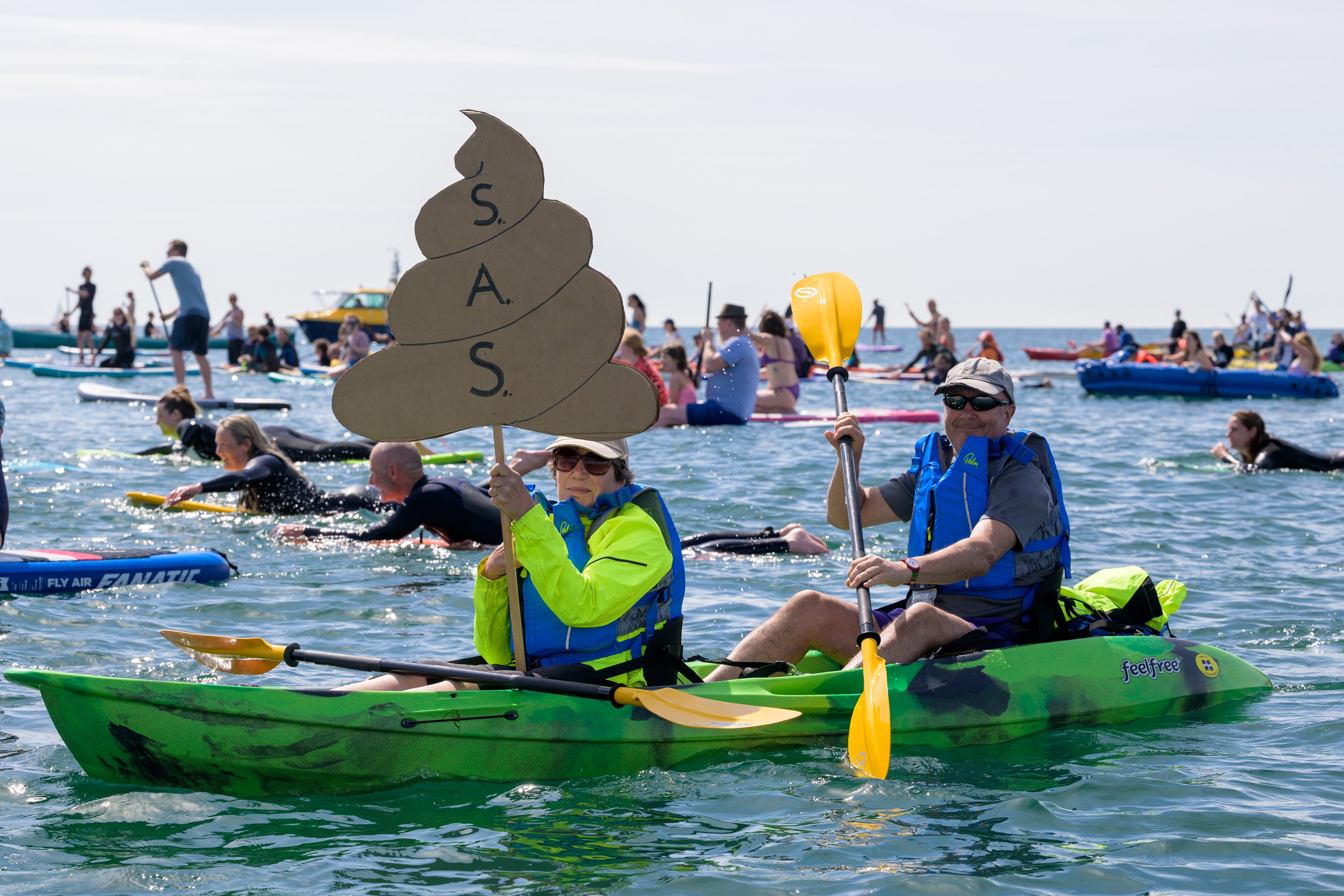 People take part in a protest by Surfers Against Sewage in Falmouth