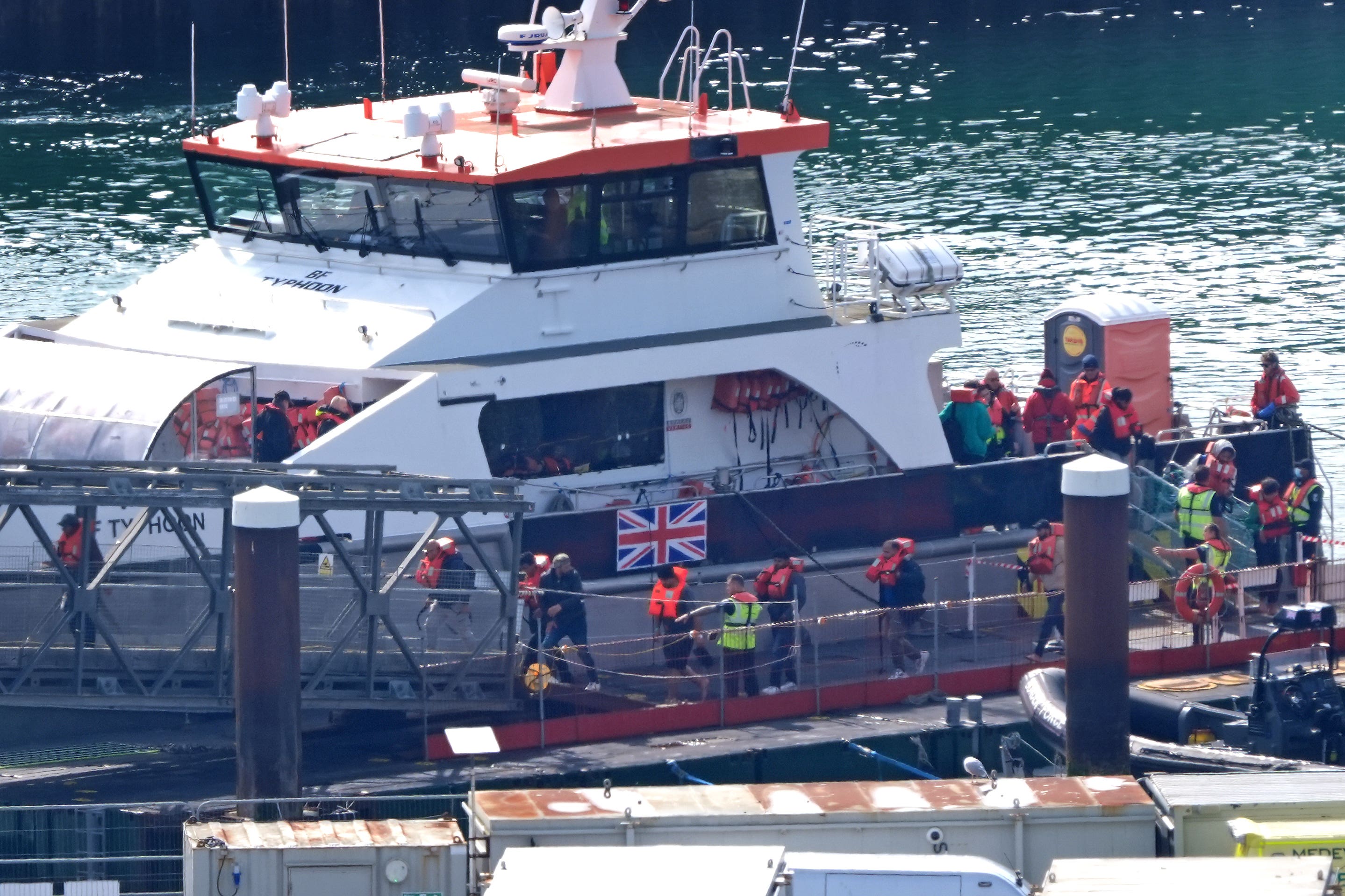 A group of people thought to be migrants are brought in to Dover, Kent, from a Border Force vessel following a small boat incident in the Channel (Gareth Fuller/PA)