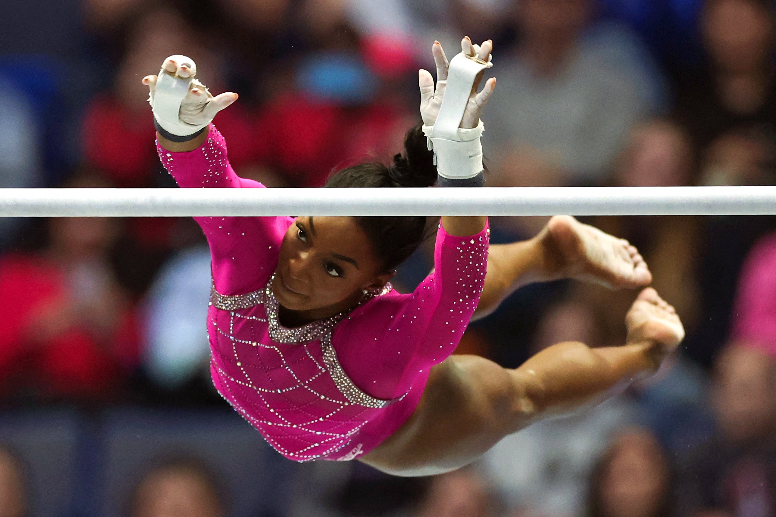 US gymnast Simone Biles competes in the uneven bars event during the Core Hydration Classic at XL Center