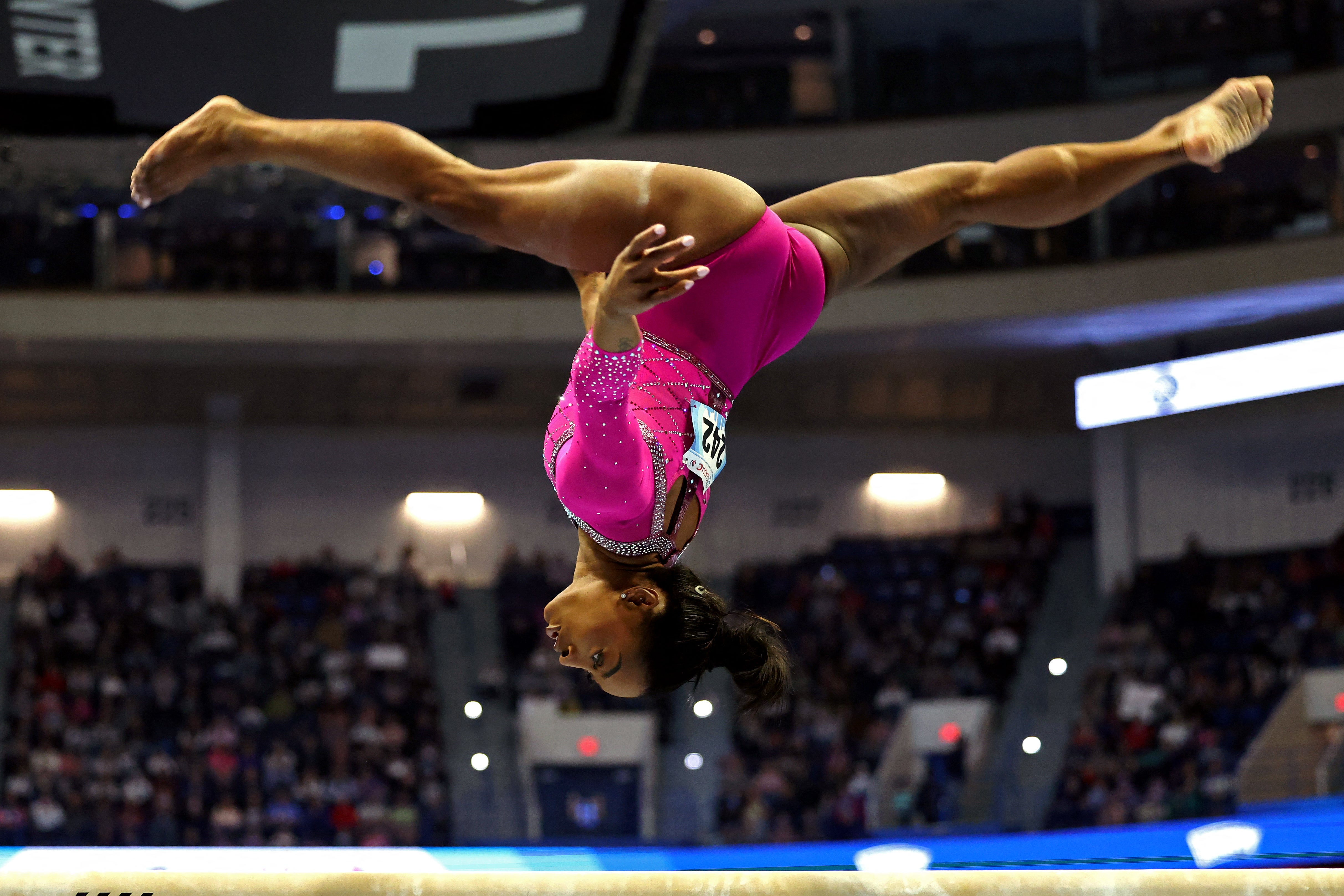 US gymnast Simone Biles competes in the balance beam event during the Core Hydration Classic