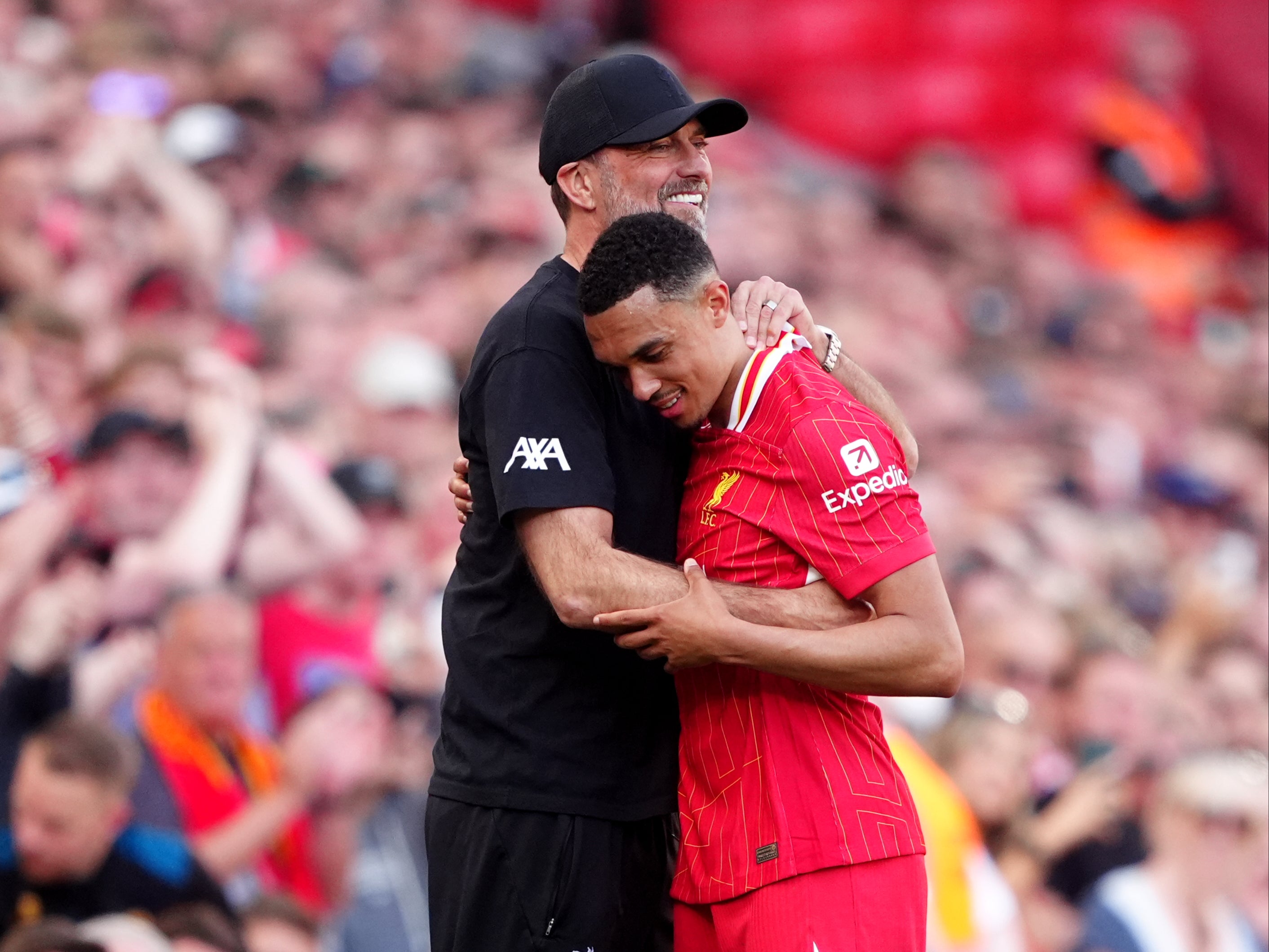 Trent Alexander-Arnold embraces Jurgen Klopp after being substituted