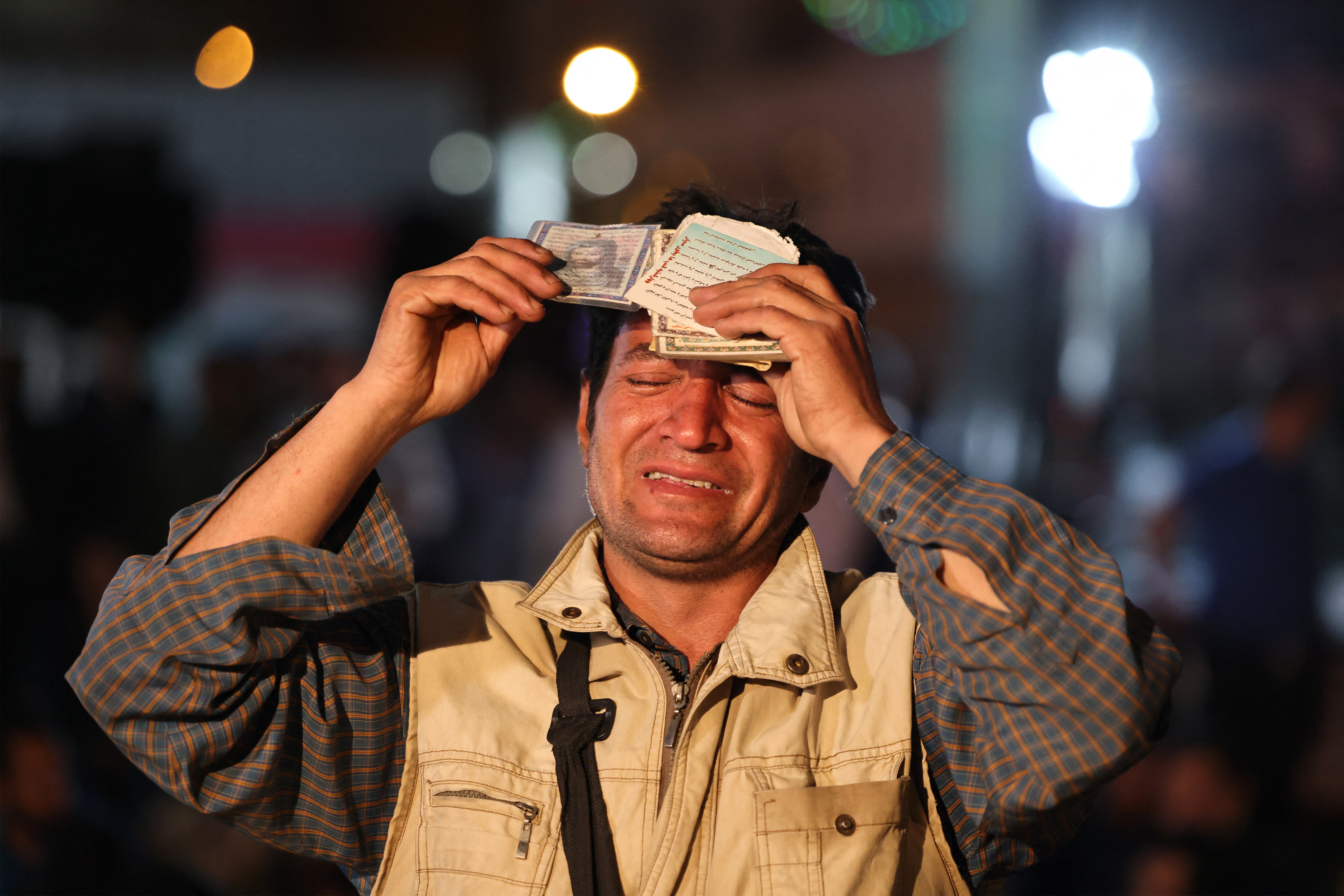 In Tehran, Iranian men and women were pictured publicly praying for their missing president