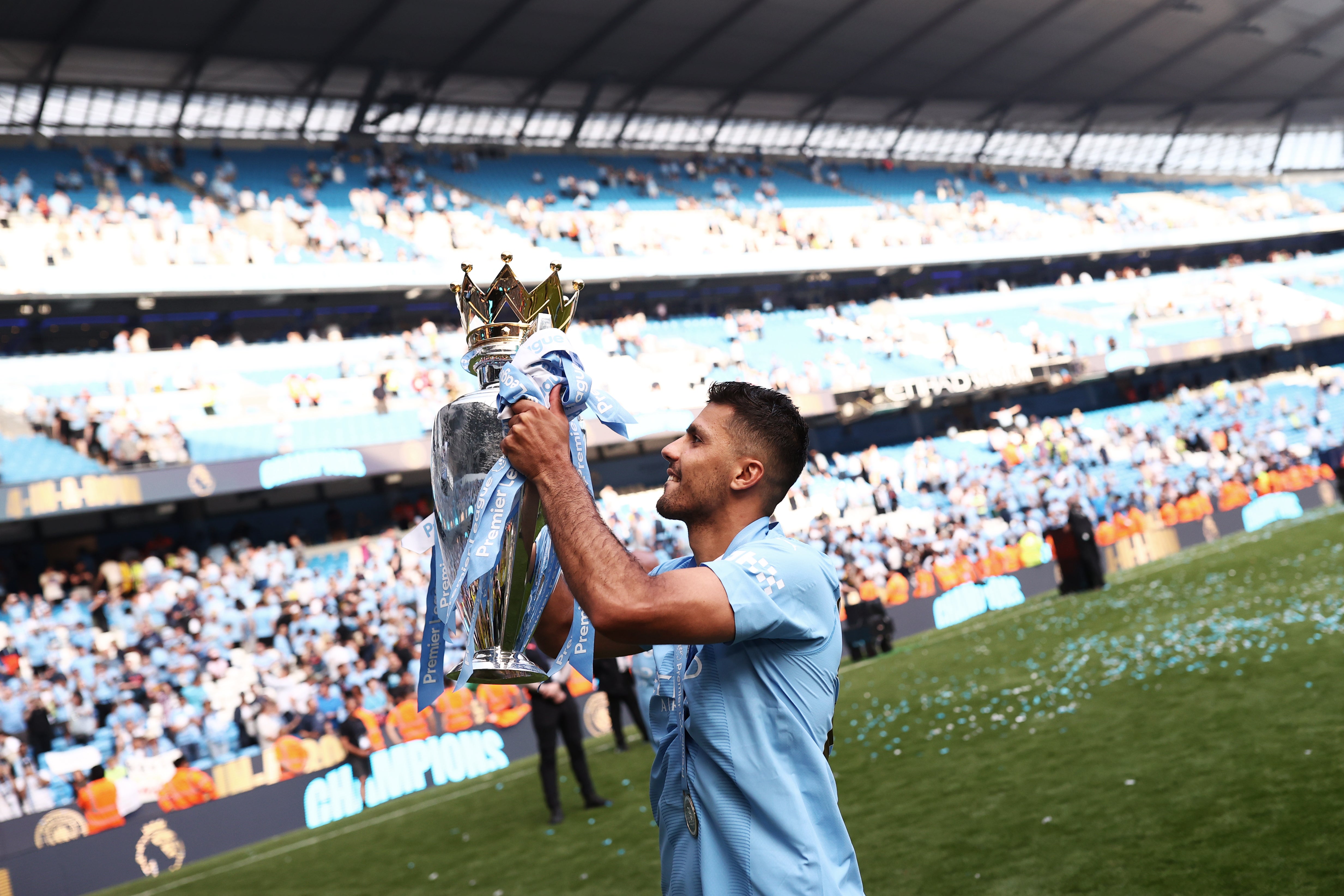 Rodri with the Premier League title