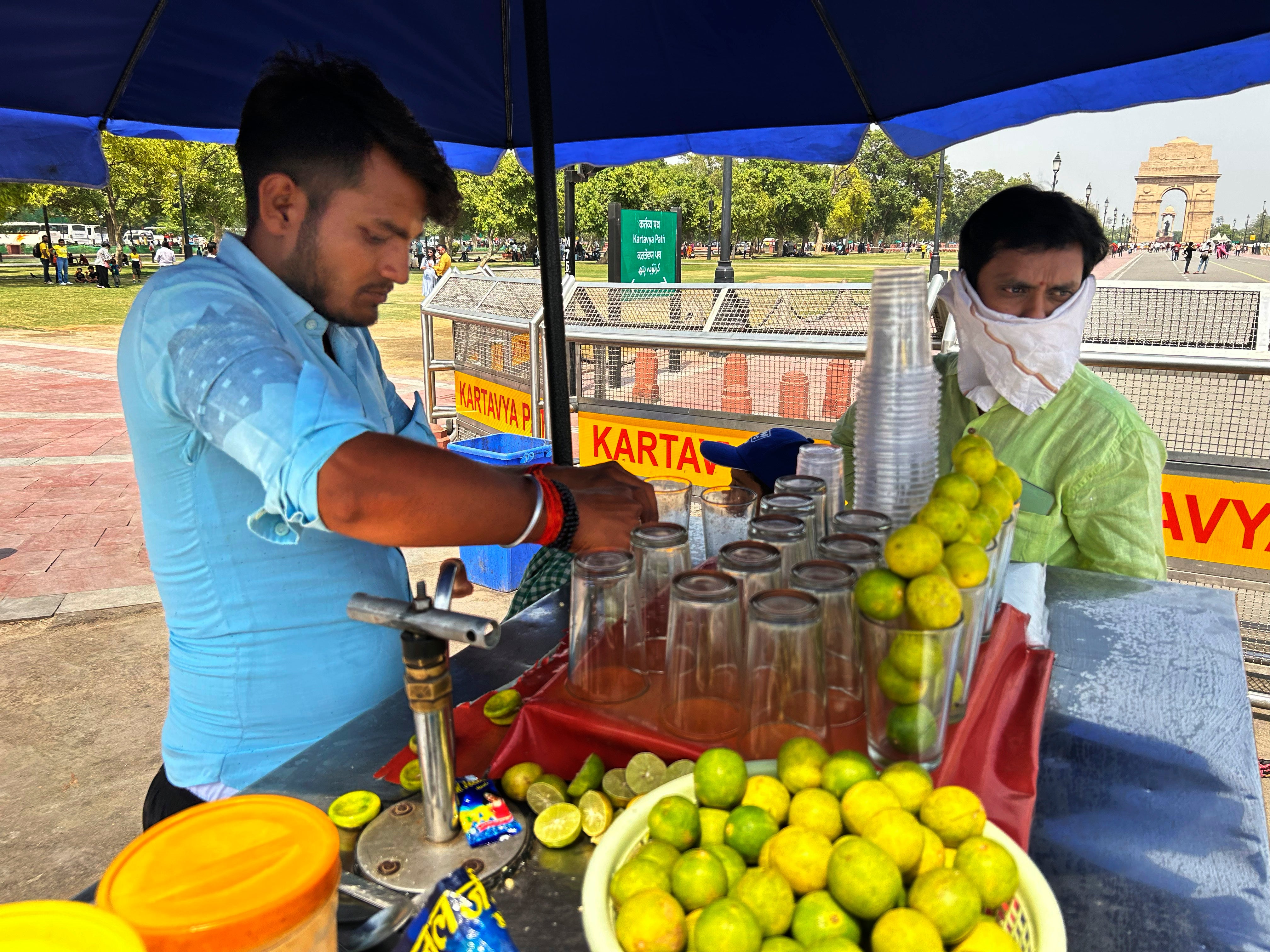 A roadside vendor sells iced lemonade in Delhi