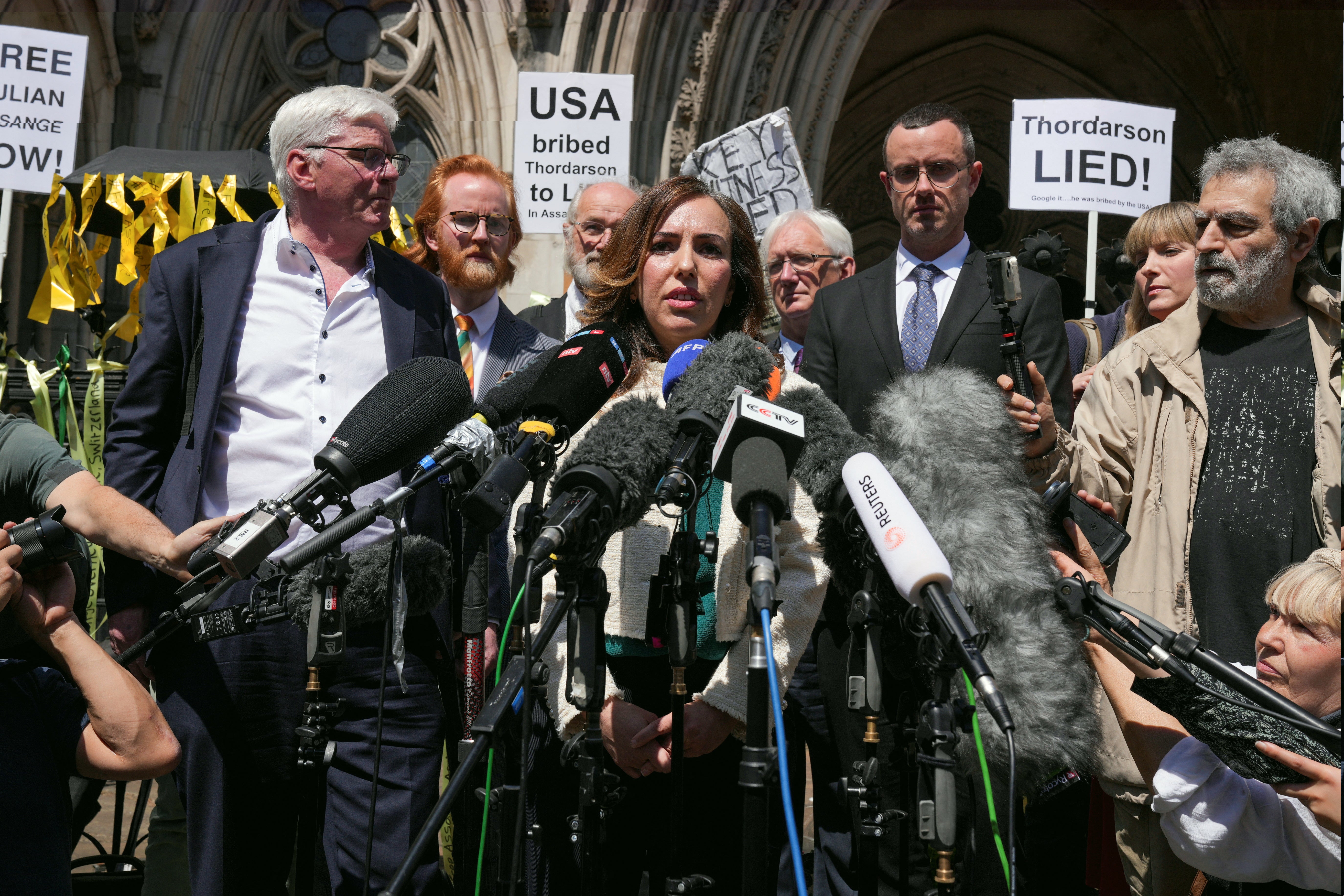 Stella Assange addresses the media outside the High Court on Monday