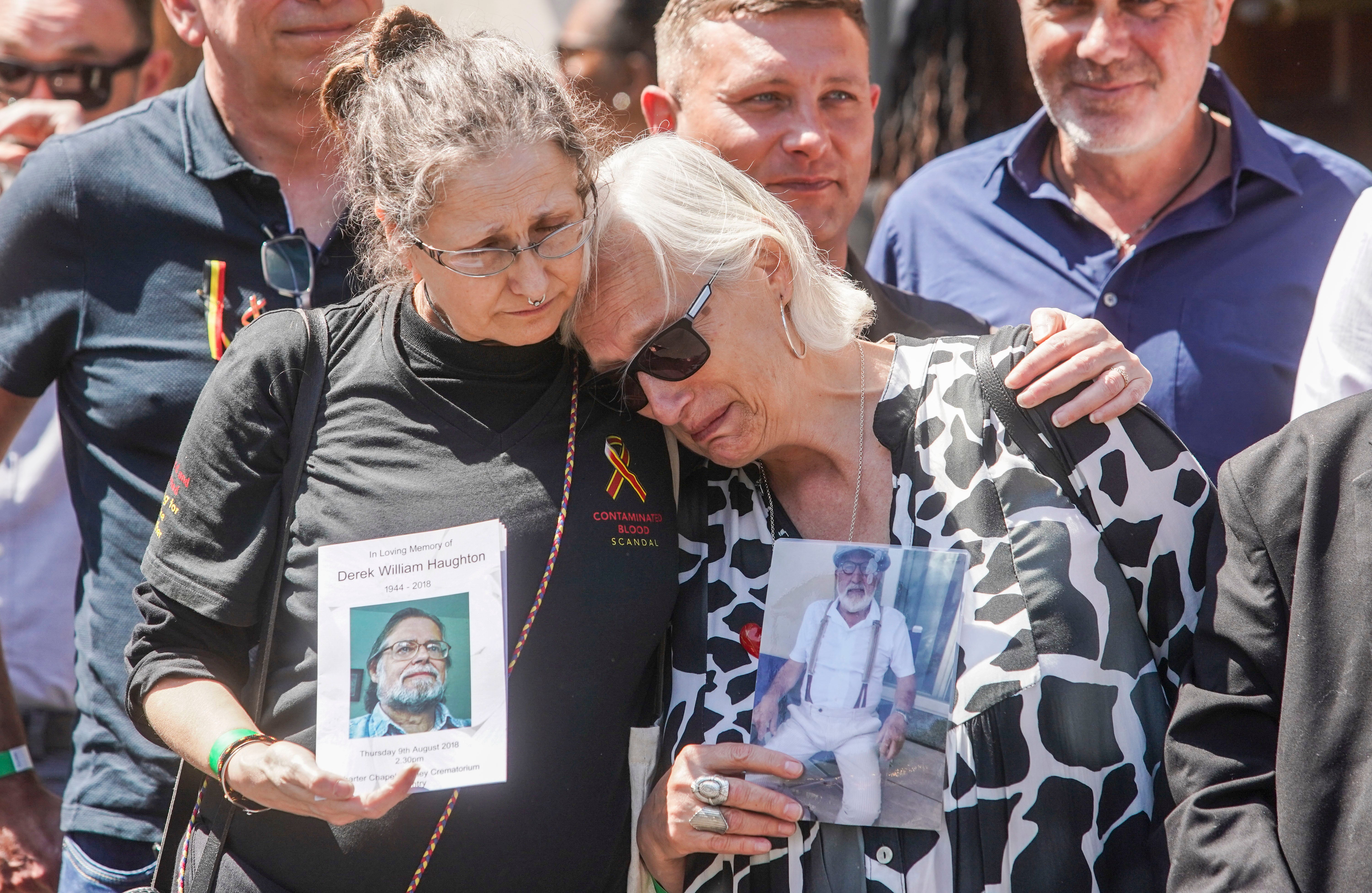 Cressida Haughton (left) whose father Derek and Deborah Dennis who's father Dennis died, outside Central Hall in Westminster