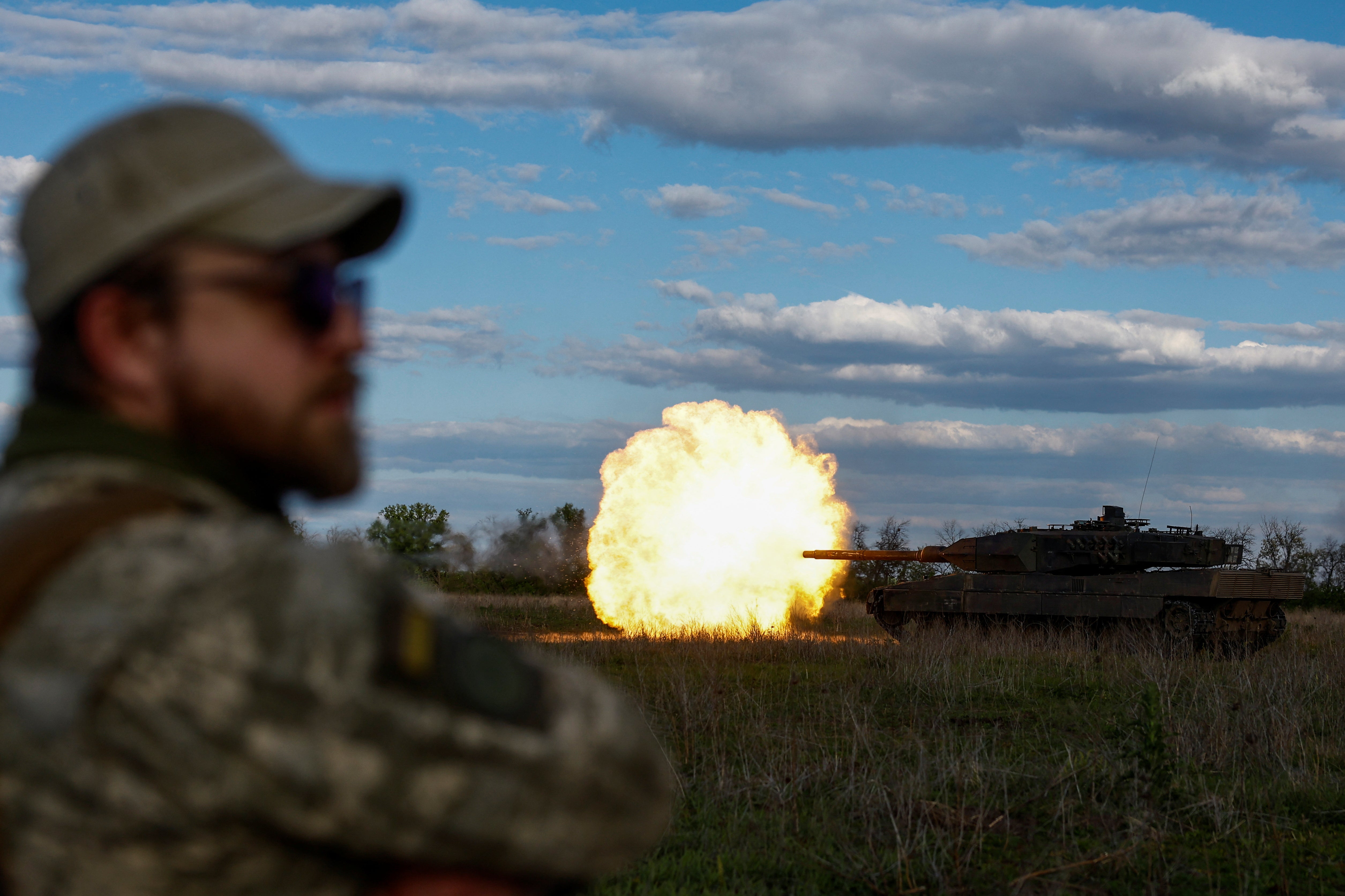 Ukrainian servicemen fire a Leopard 2A6 tank during a military exercise in the Donetsk region