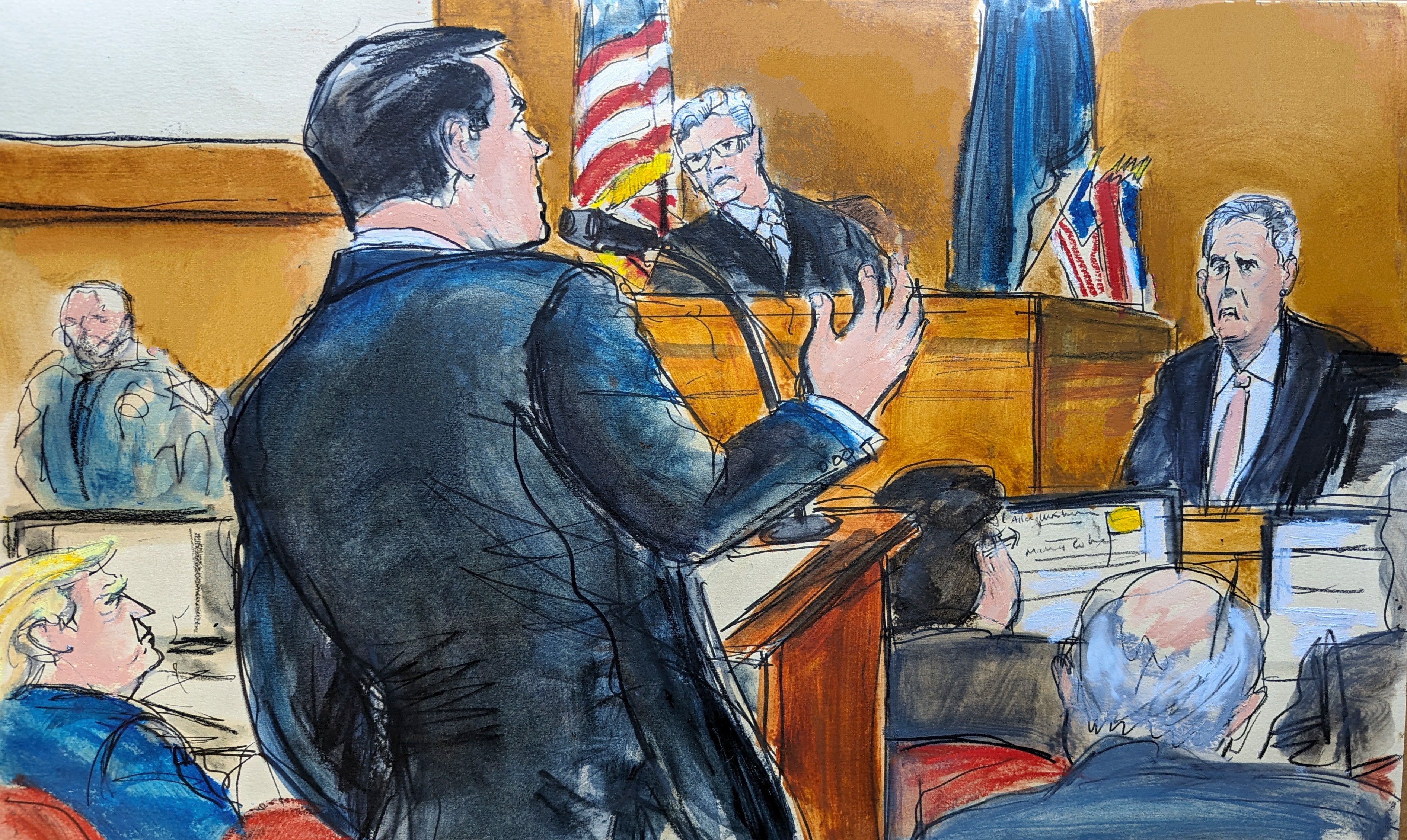 Donald Trump, far left, watches as defense attorney Todd Blanche, at podium, cross examines Michael Cohen on the witness stand with Judge Juan Merchan presiding