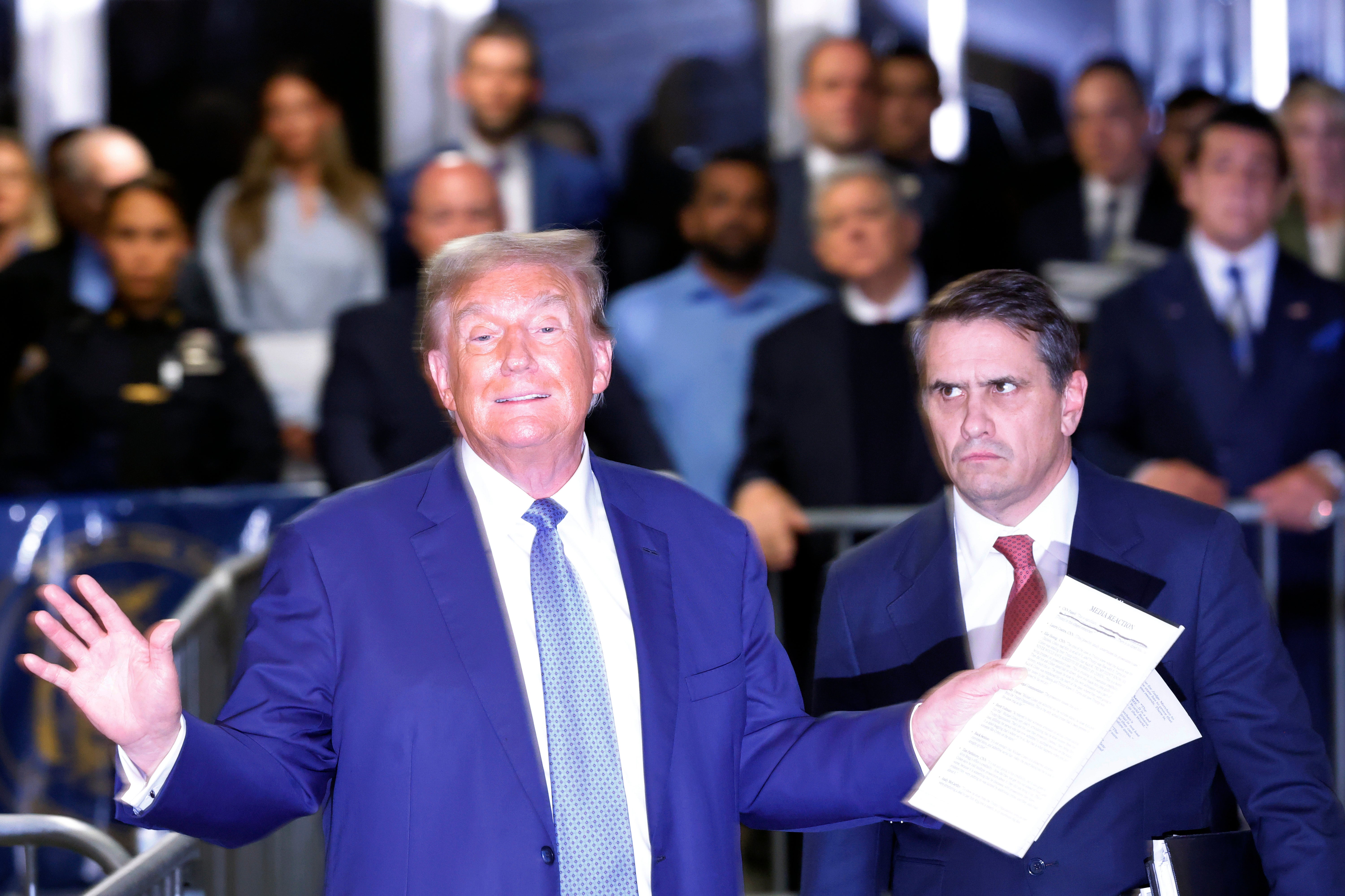 Donald Trump addresses reporters outside his hush money trial next to defense attorney Todd Blanche on May 20.