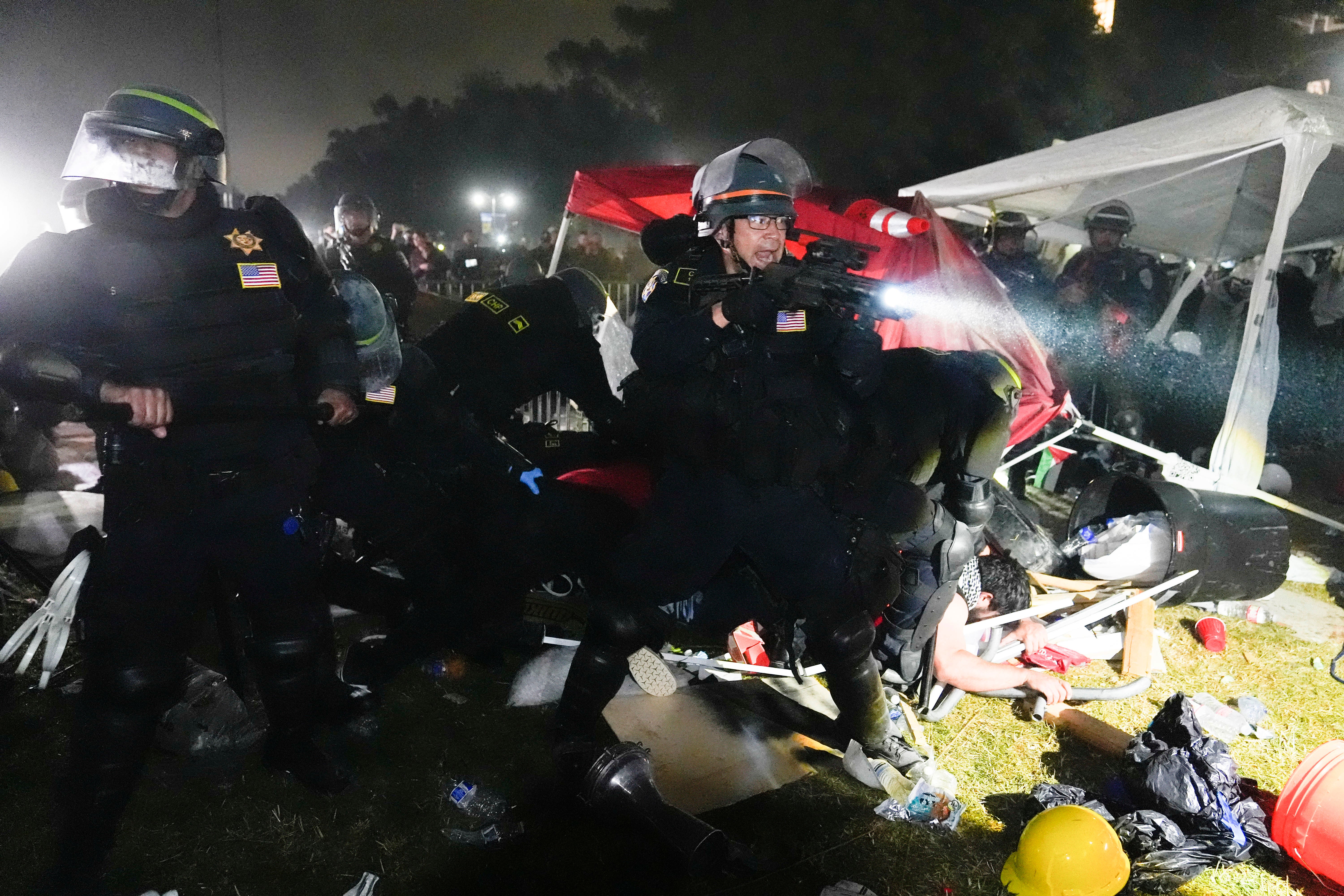 Police advance on pro-Palestinian demonstrators in an encampment on the UCLA campus, May 2, 2024, in Los Angeles