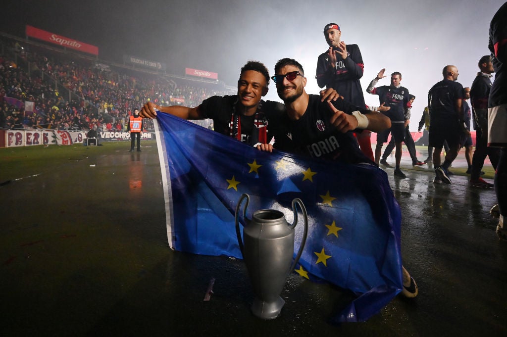 Bologna’s players celebrated guaranteeing themselves a Champions League spot after a draw with Juventus