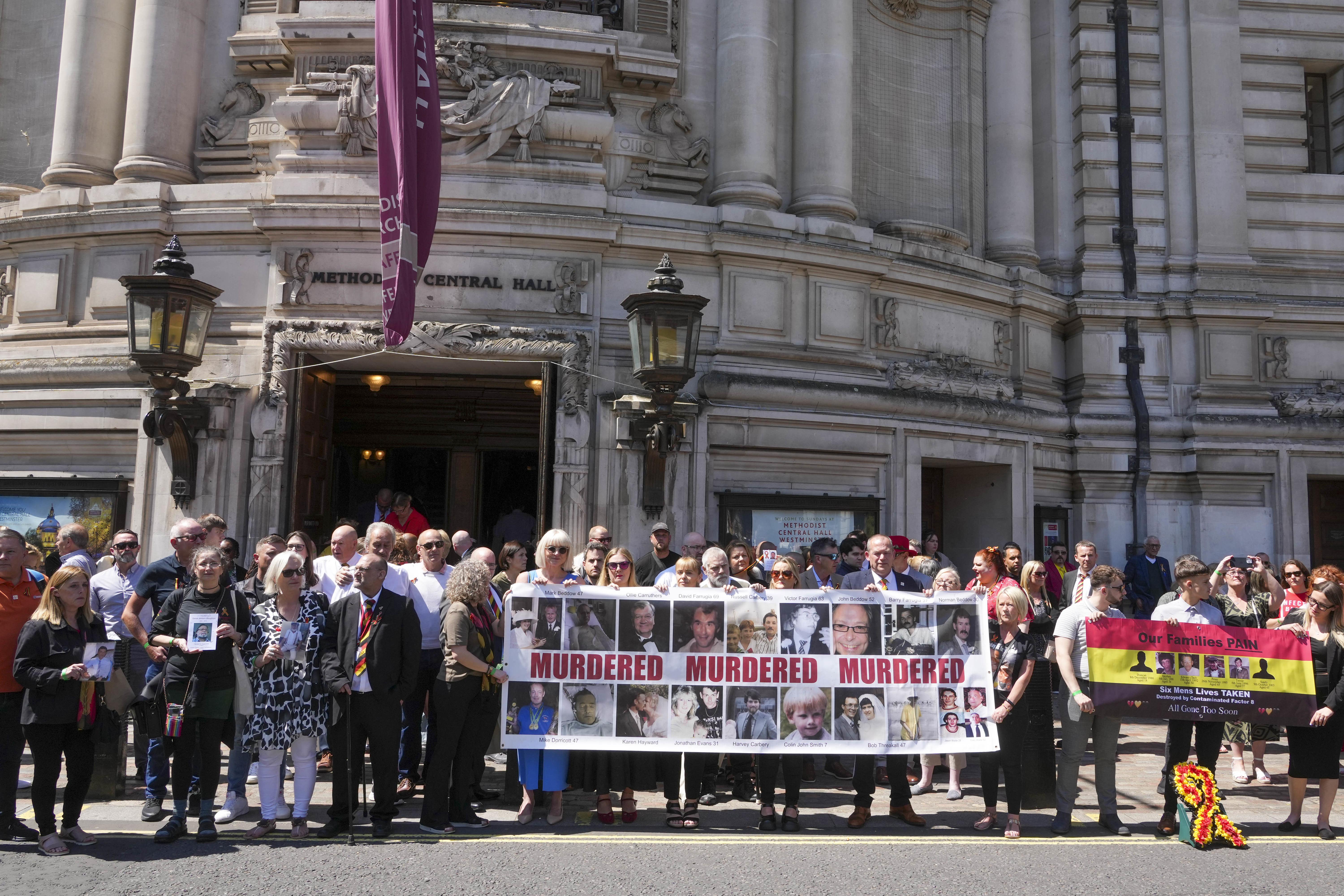 Victims and campaigners outside Central Hall in Westminster after the publication of the infected blood inquiry report on Monday