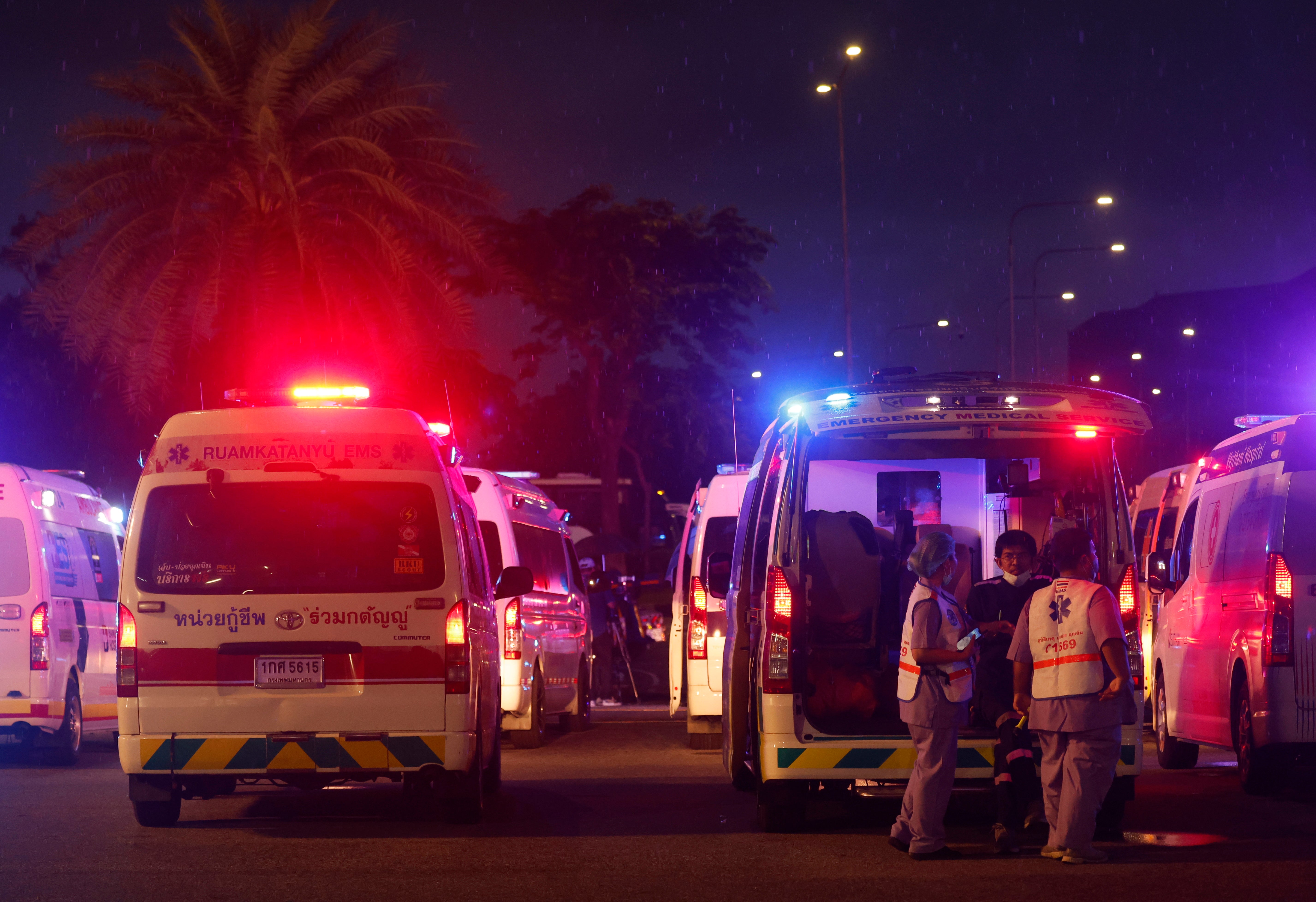 Rescue medical teams prepare to move the injured to a hospital near Suvarnabhumi Airport in Samut Prakan province in Thailand on Tuesday