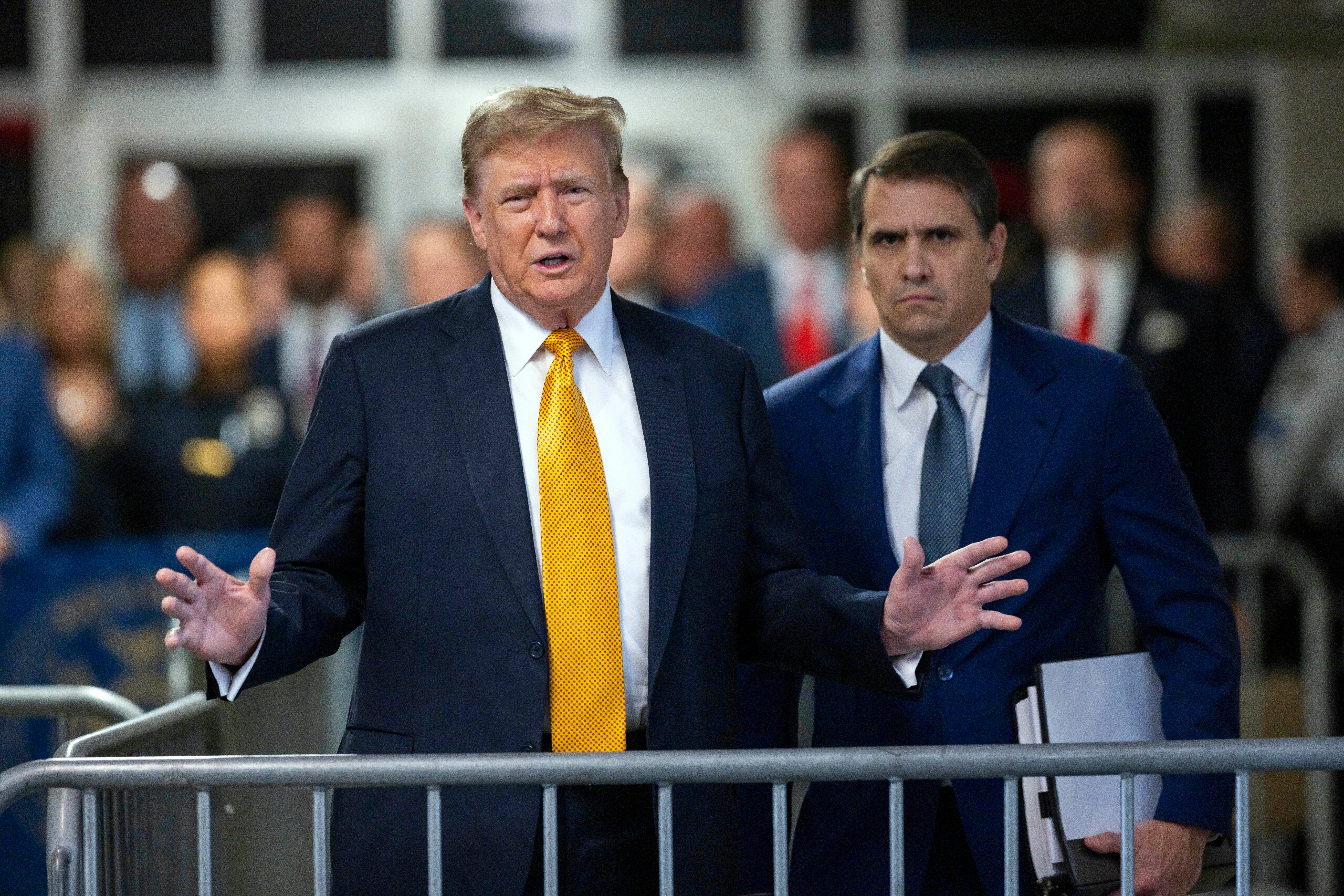 Former President Donald Trump speaks alongside his attorney Todd Blanche outside the courtroom in Manhattan Criminal Court on May 21