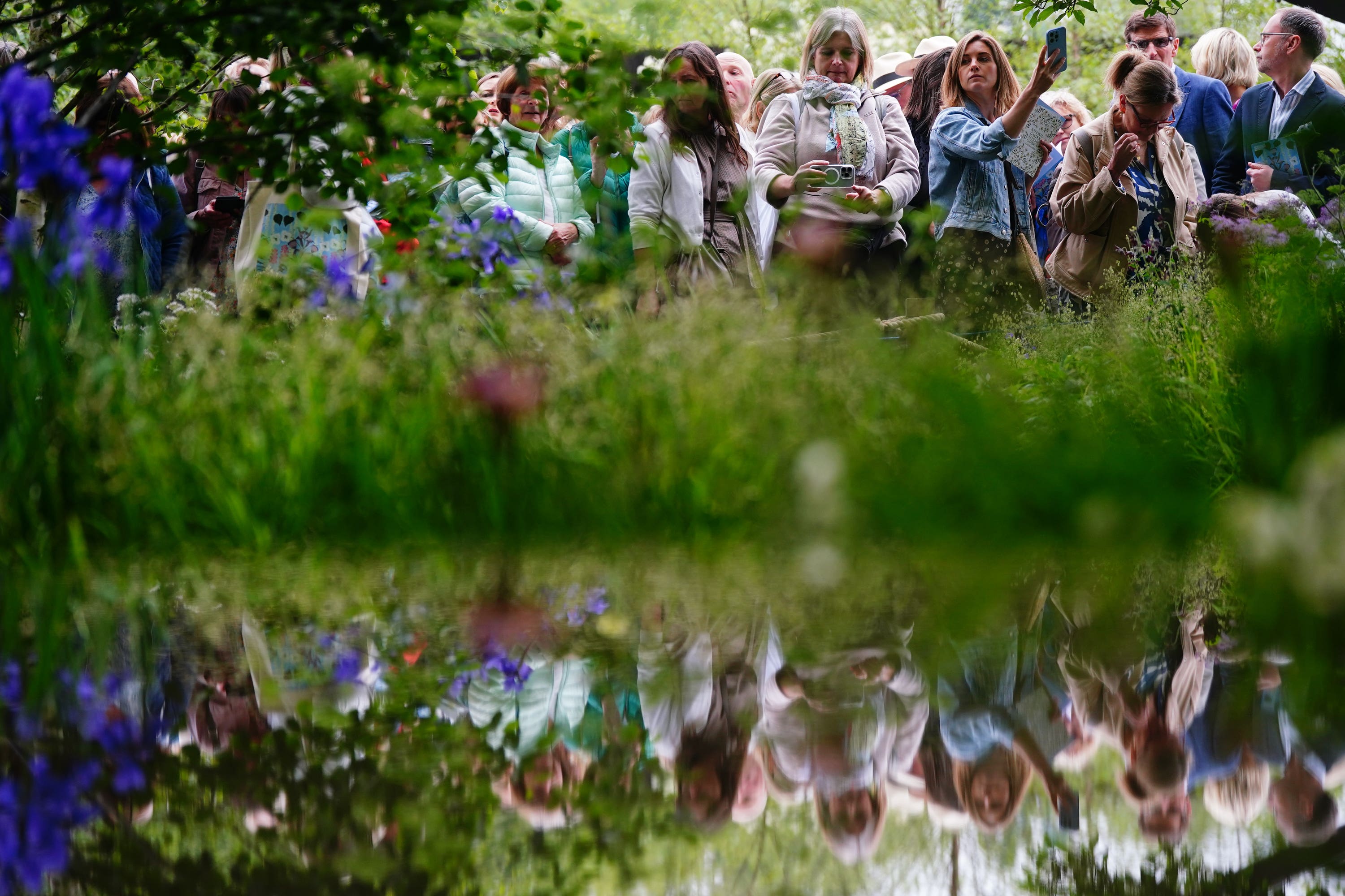 Guests view the Forest Bathing Garden, winner of the RHS Chelsea Best in Show, designed by first- time competitor Ula Maria (Victoria Jones/PA)