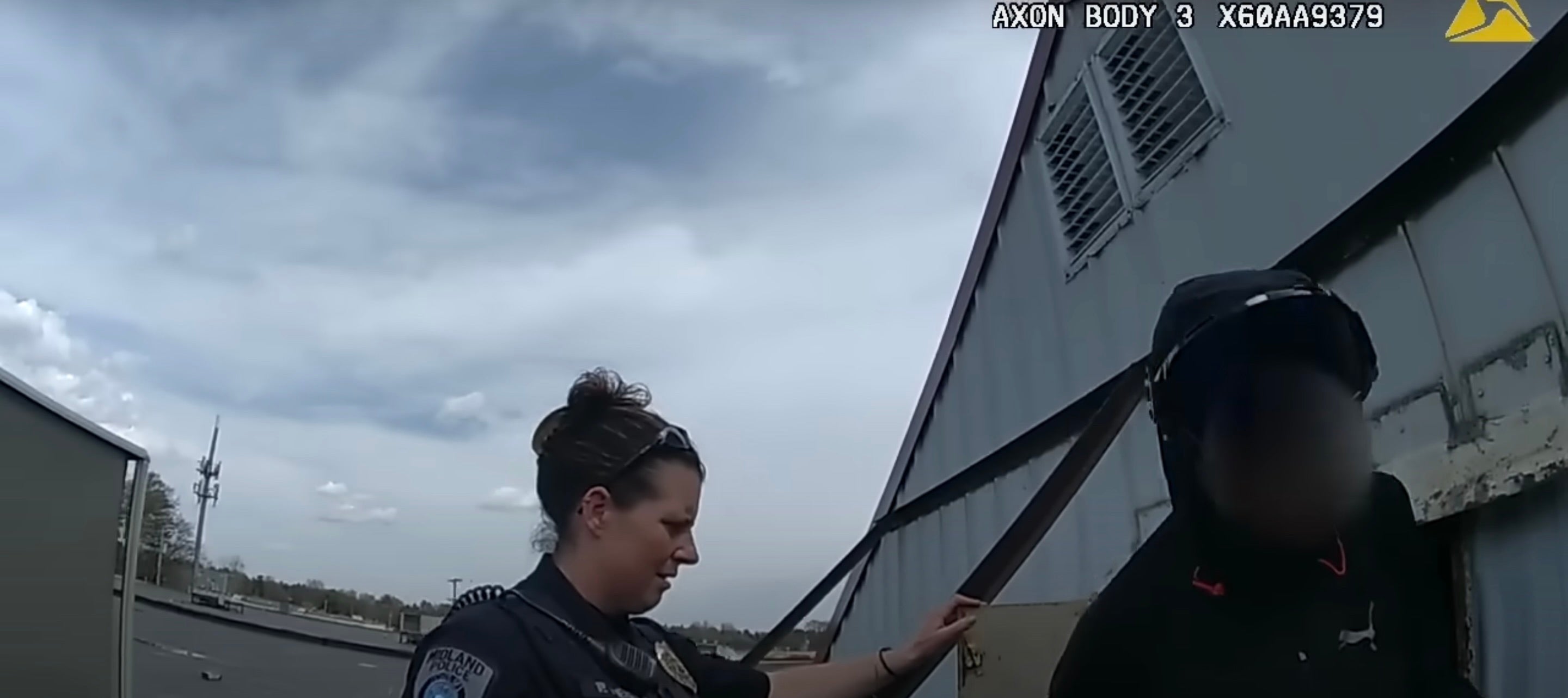 A woman created a small apartment out of a sign on top of a Family Dollar store in Michigan, police say