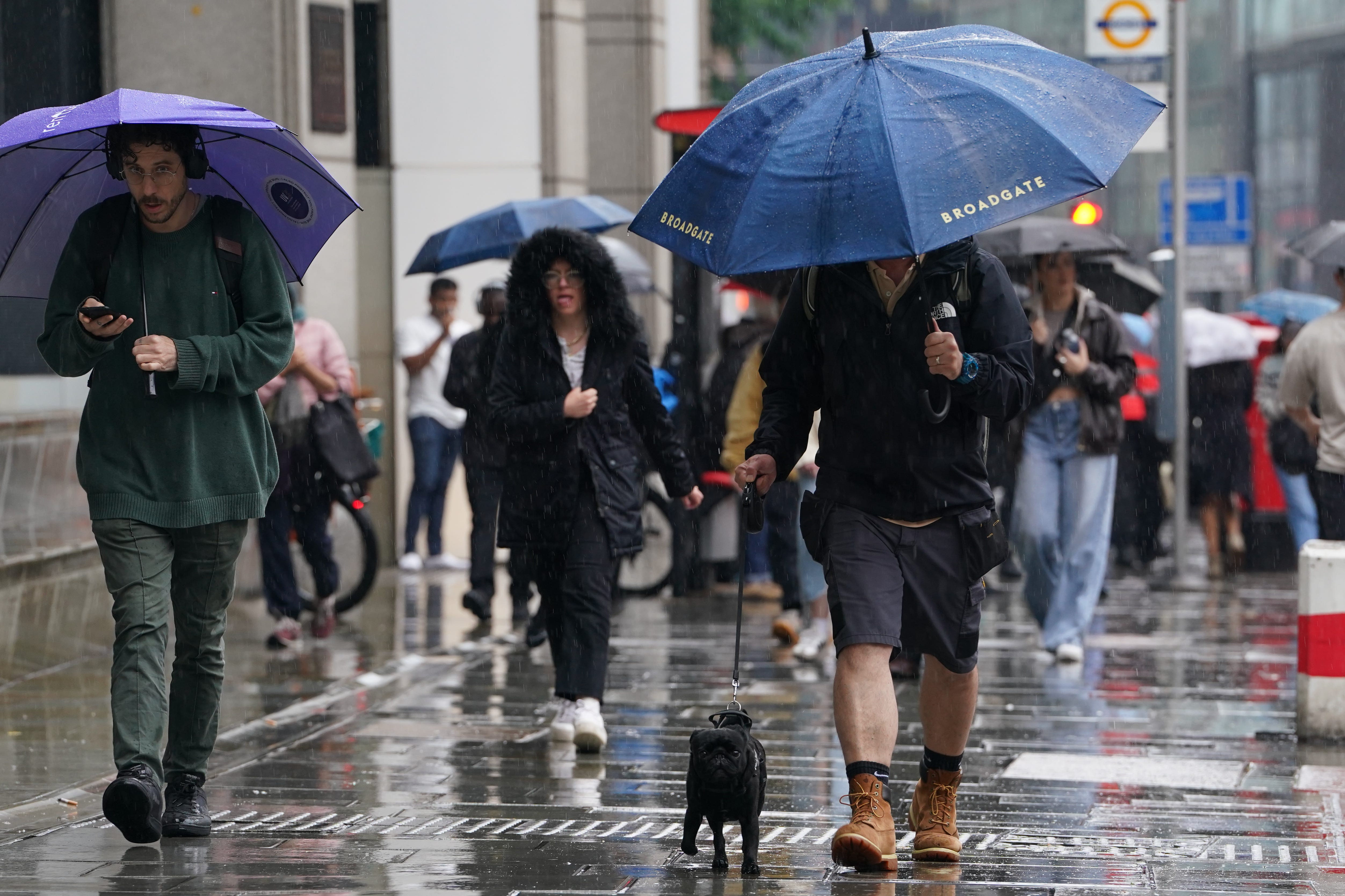 People walk in the rain near Liverpool Street in London on Tuesday (Lucy North/PA)